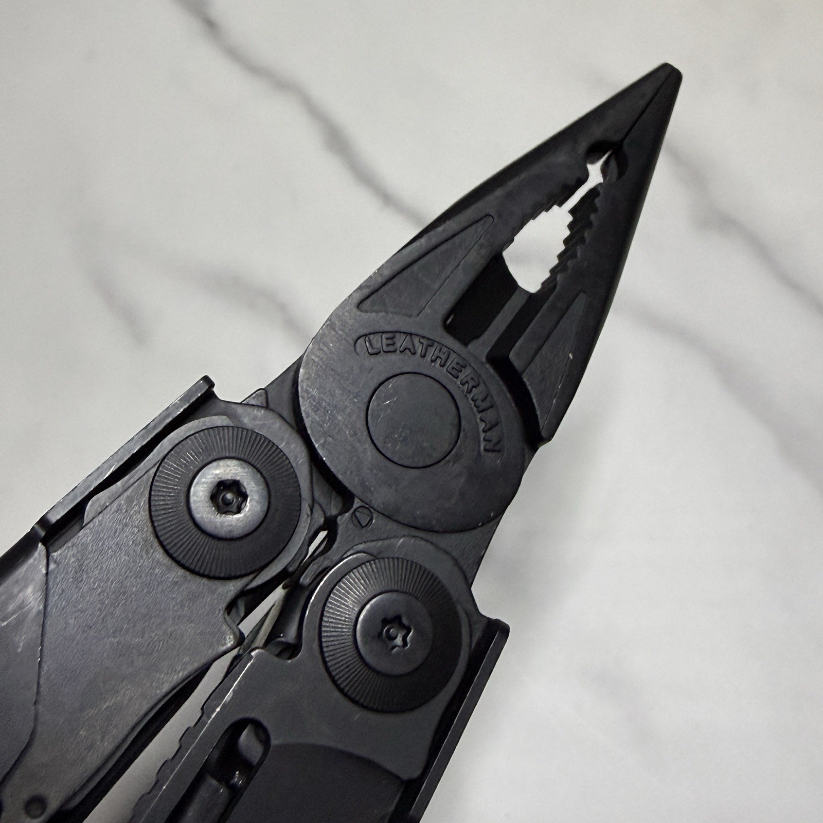 Leatherman Surge Cap Crimper Black Multitool w/Molle Sheath. Discontinued
