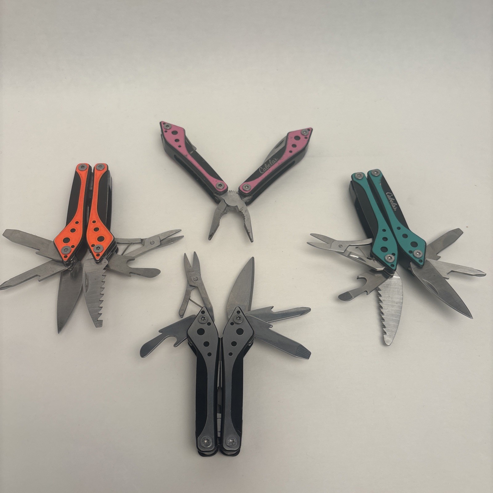 Cabela’s LOT of 4, Orange Teal Silver Pink Small Multi-Tool Camp Hike Hunt Fish