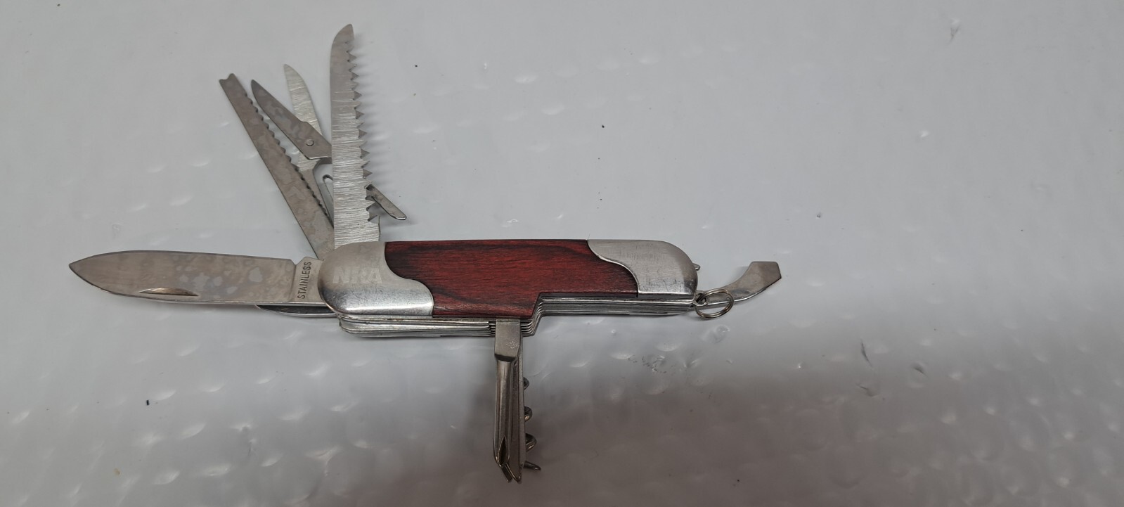 NRA LOGO SS MULTI TOOL WITH 12 TOOLS AND LANYARD LOOP 10/4/1