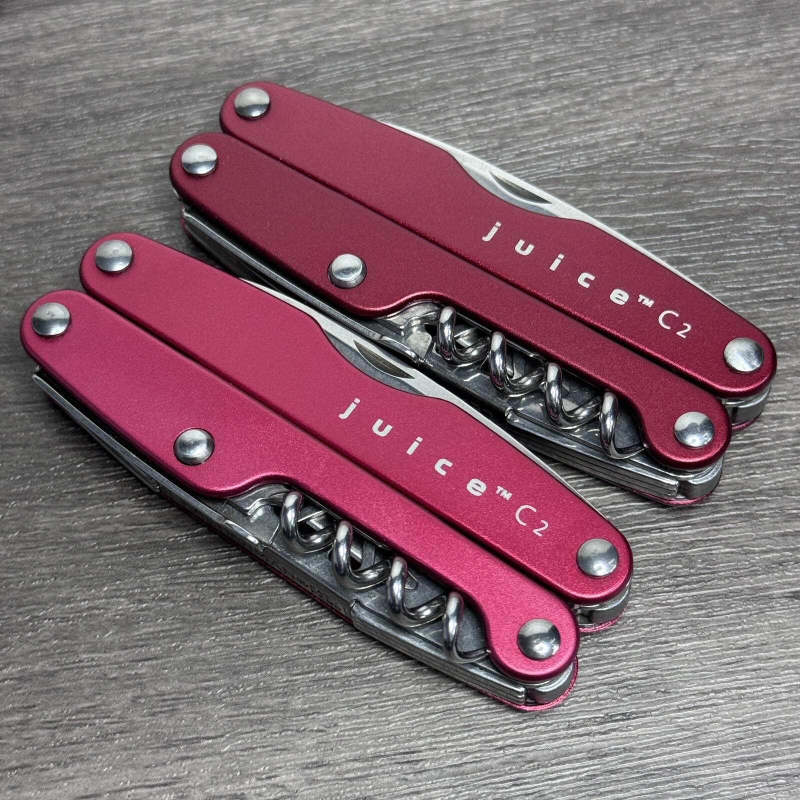 TWO Leatherman Juice C2 Red multitools. TM variants. Discontinued