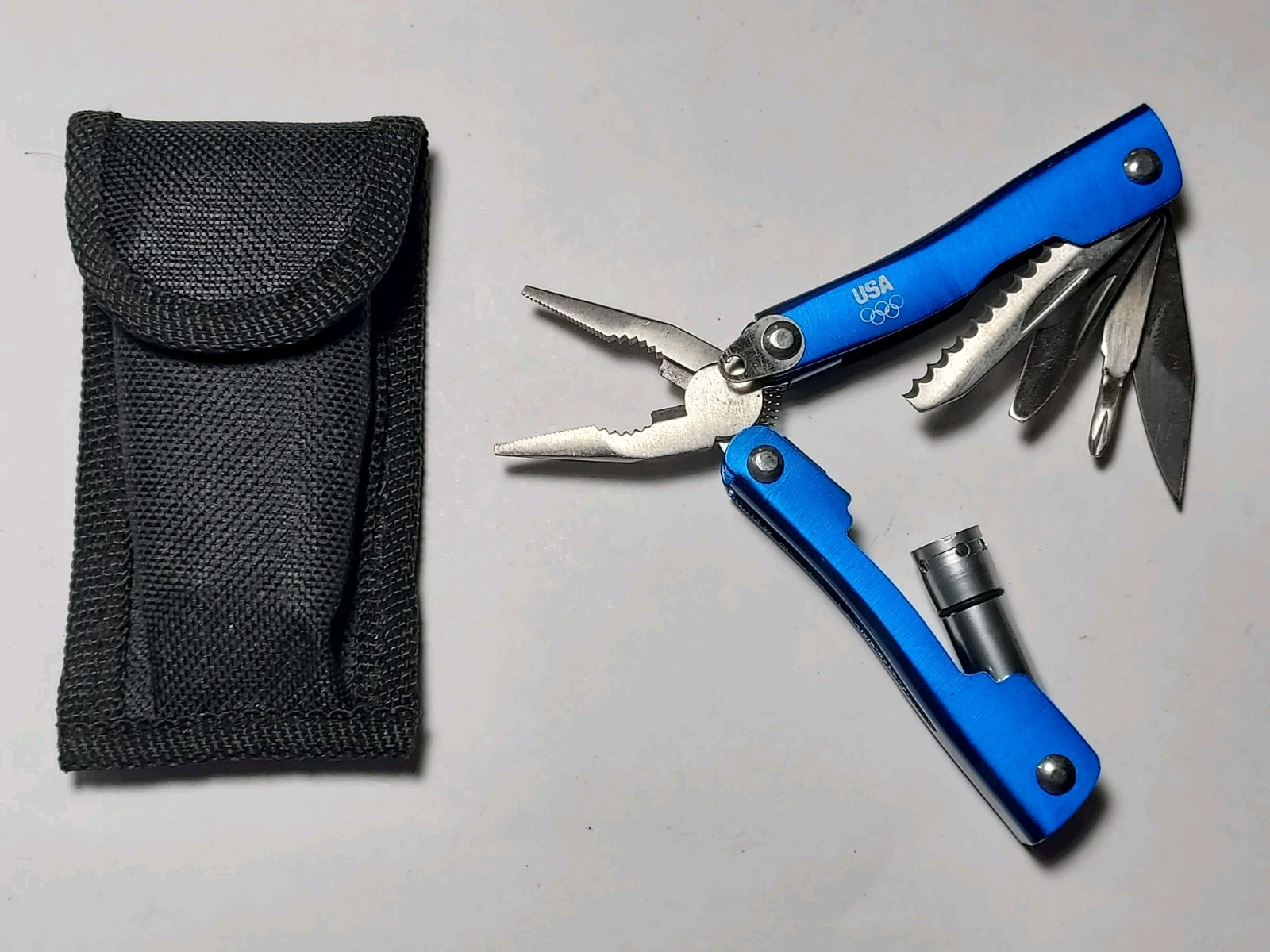 Blue Mini Multi Tool with USA & Olympic Rings + Nylon Pouch – Pliers, Blade