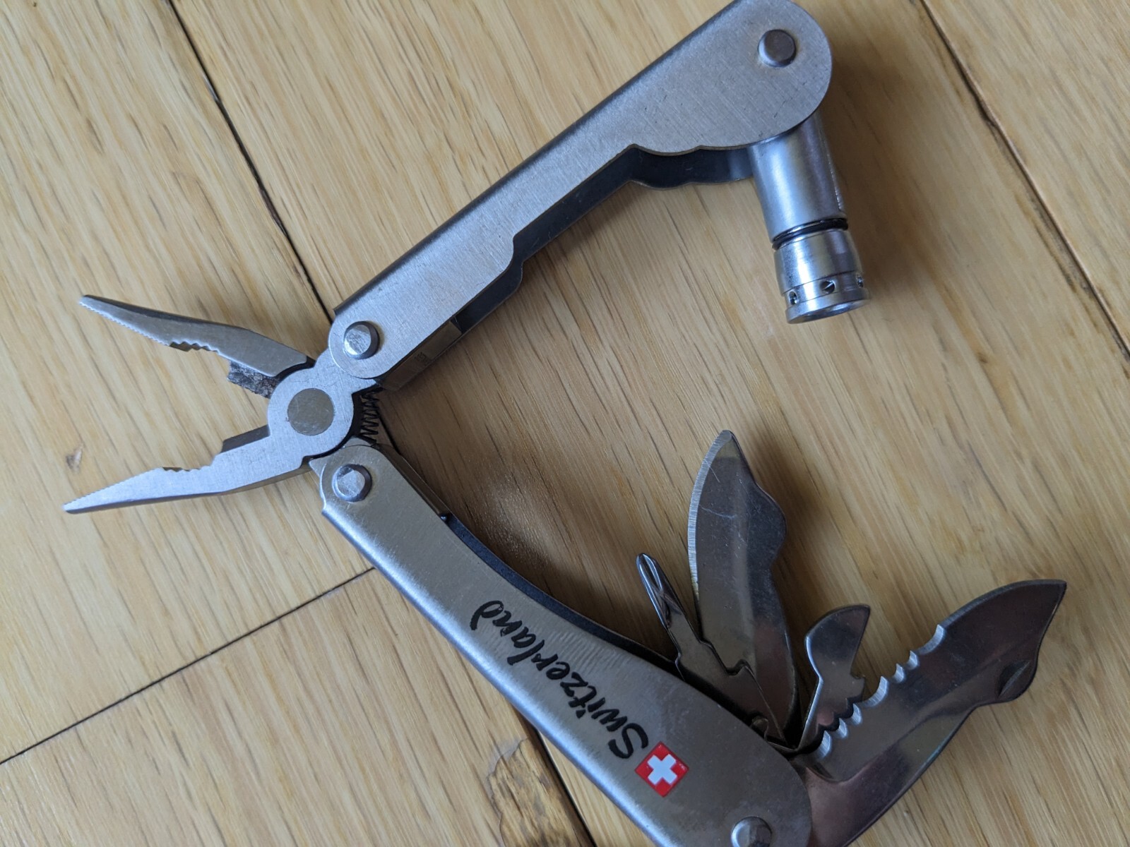 Swiss-Made Foldable Pocket Multi-Tool Stainless Steel w Pocket Clip. 8 Functions