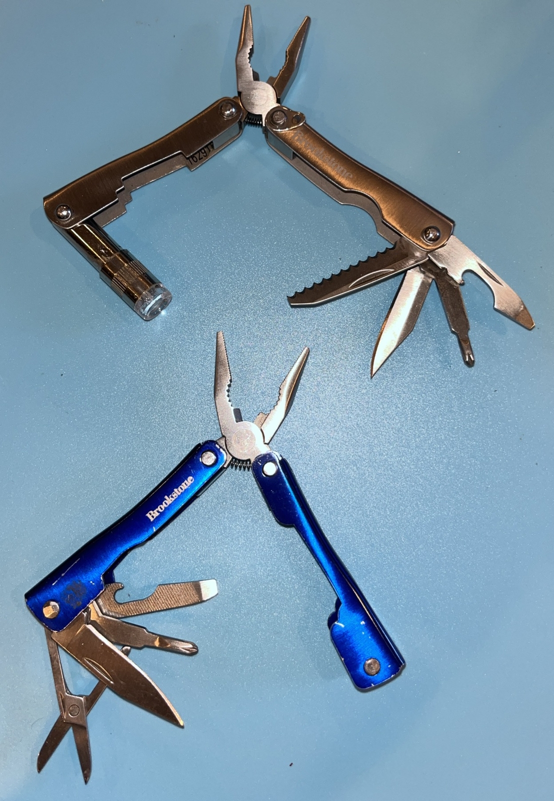 2 Brookstone Multi tool Knives, Flashlight Needs Battery