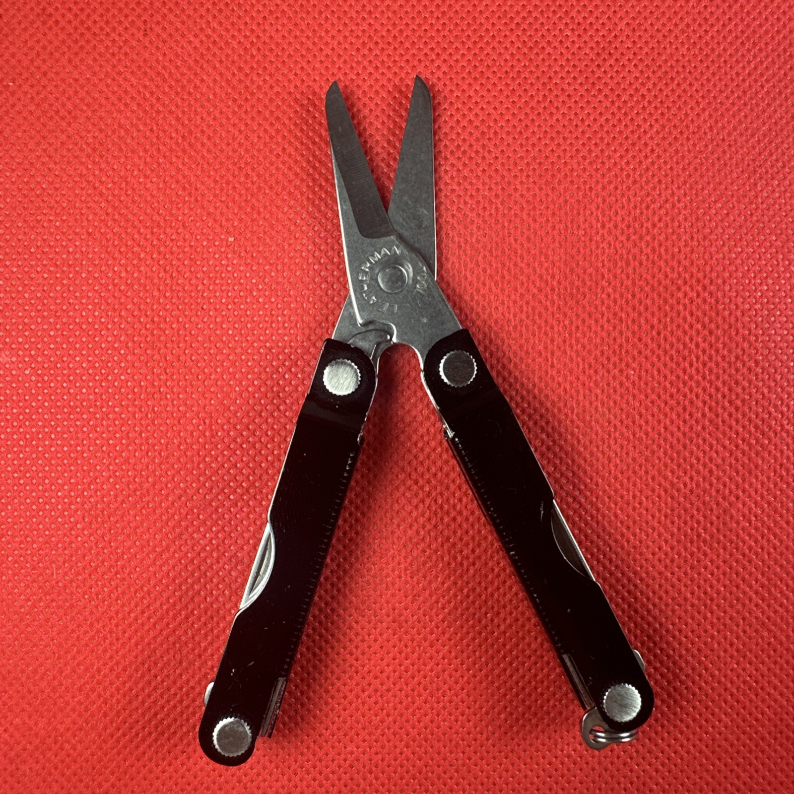 Nice Black Leatherman Micra Multi-Tool, scissor, knife, tweezer, screwdriver