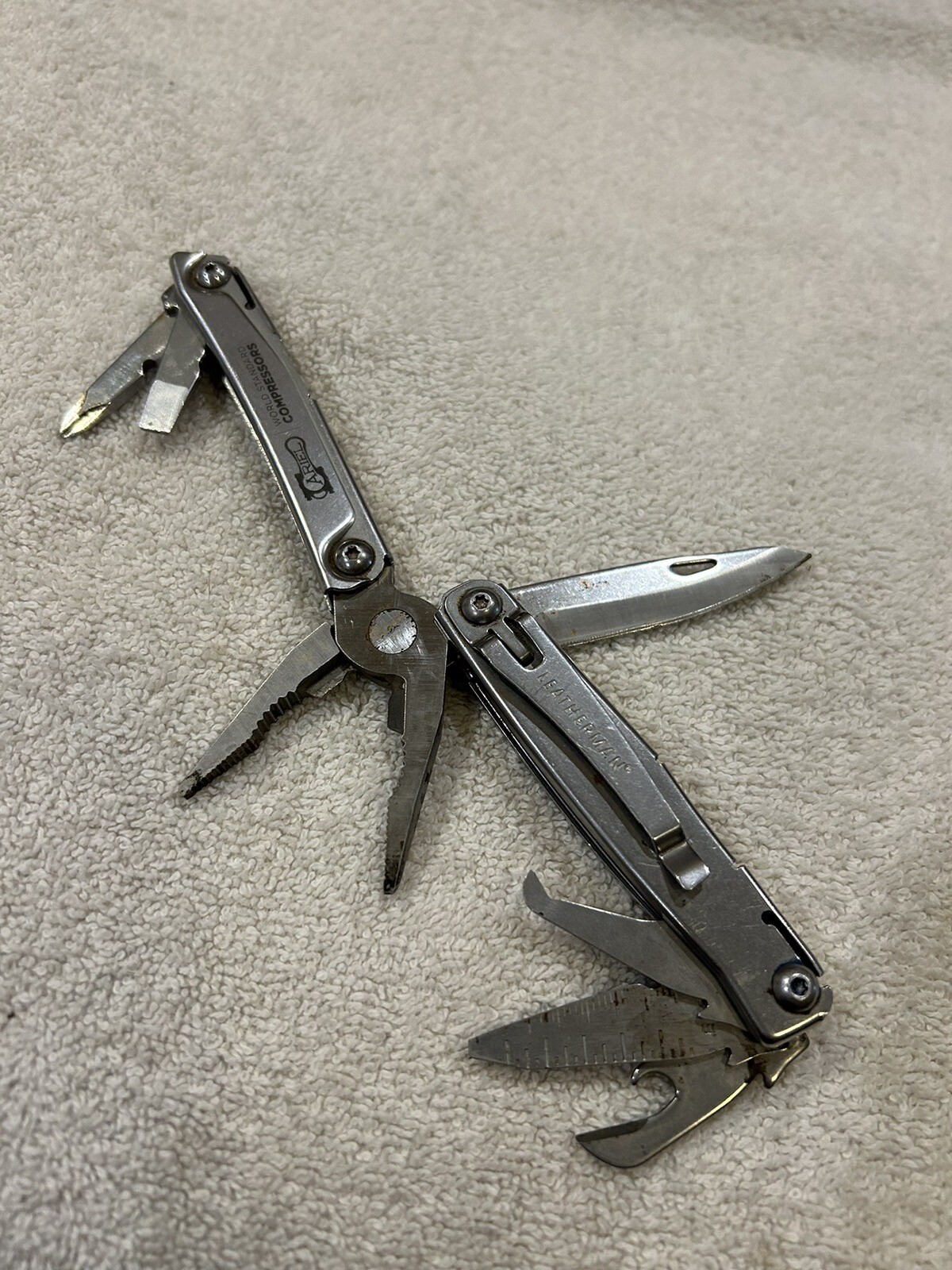 Leatherman Rev multitool with company logo