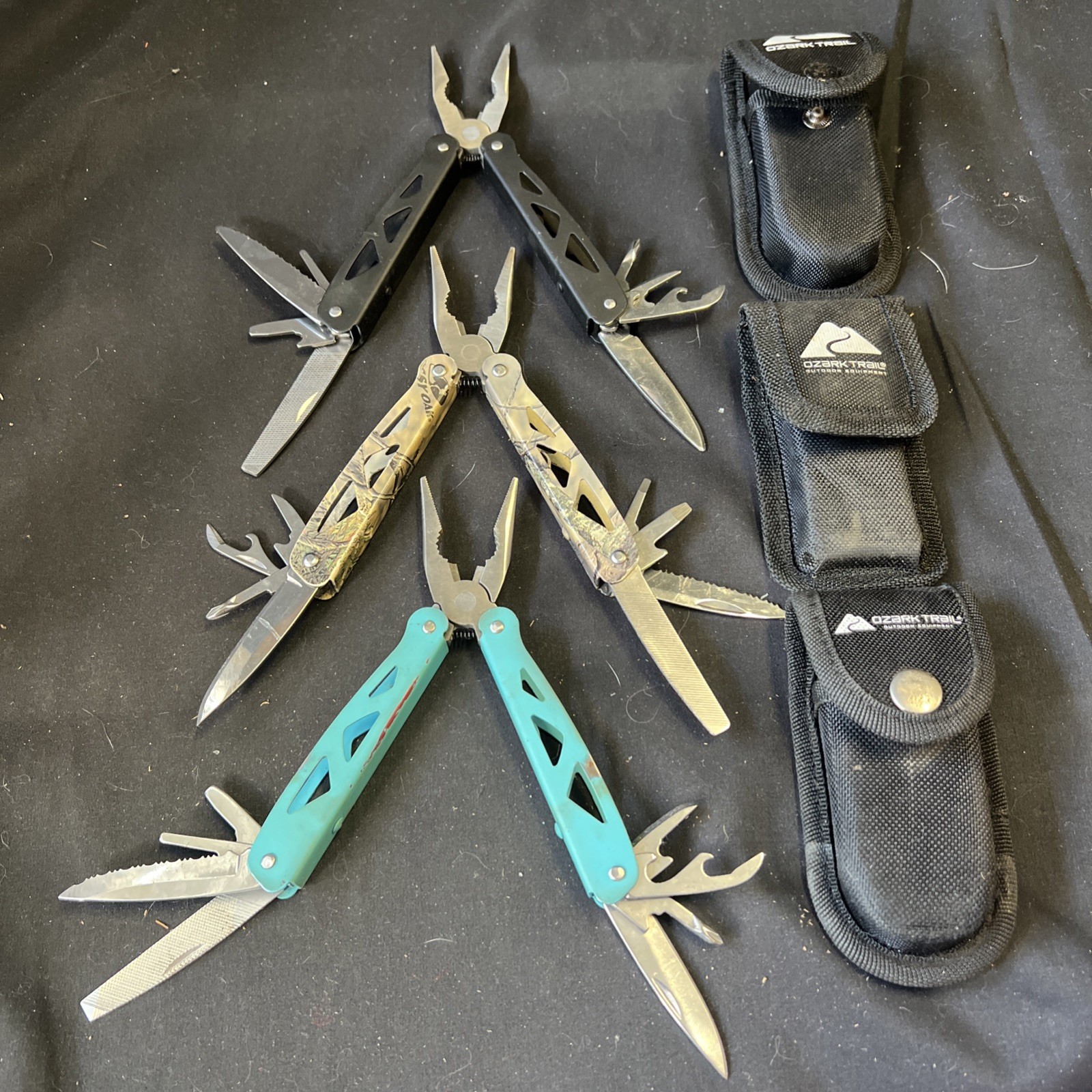 Set Of 3 Ozark Trail Trailside 12-in-1 Multitool – Black, Teal, & Camouflage