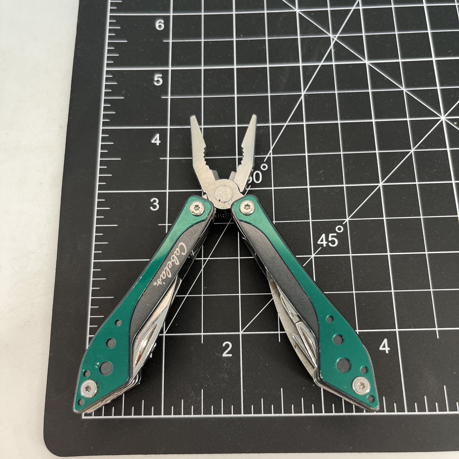LOT OF 2 Cabela’s SILVER & GREEN Mini Multi-Tool Spring Open Pliers Scissors Saw
