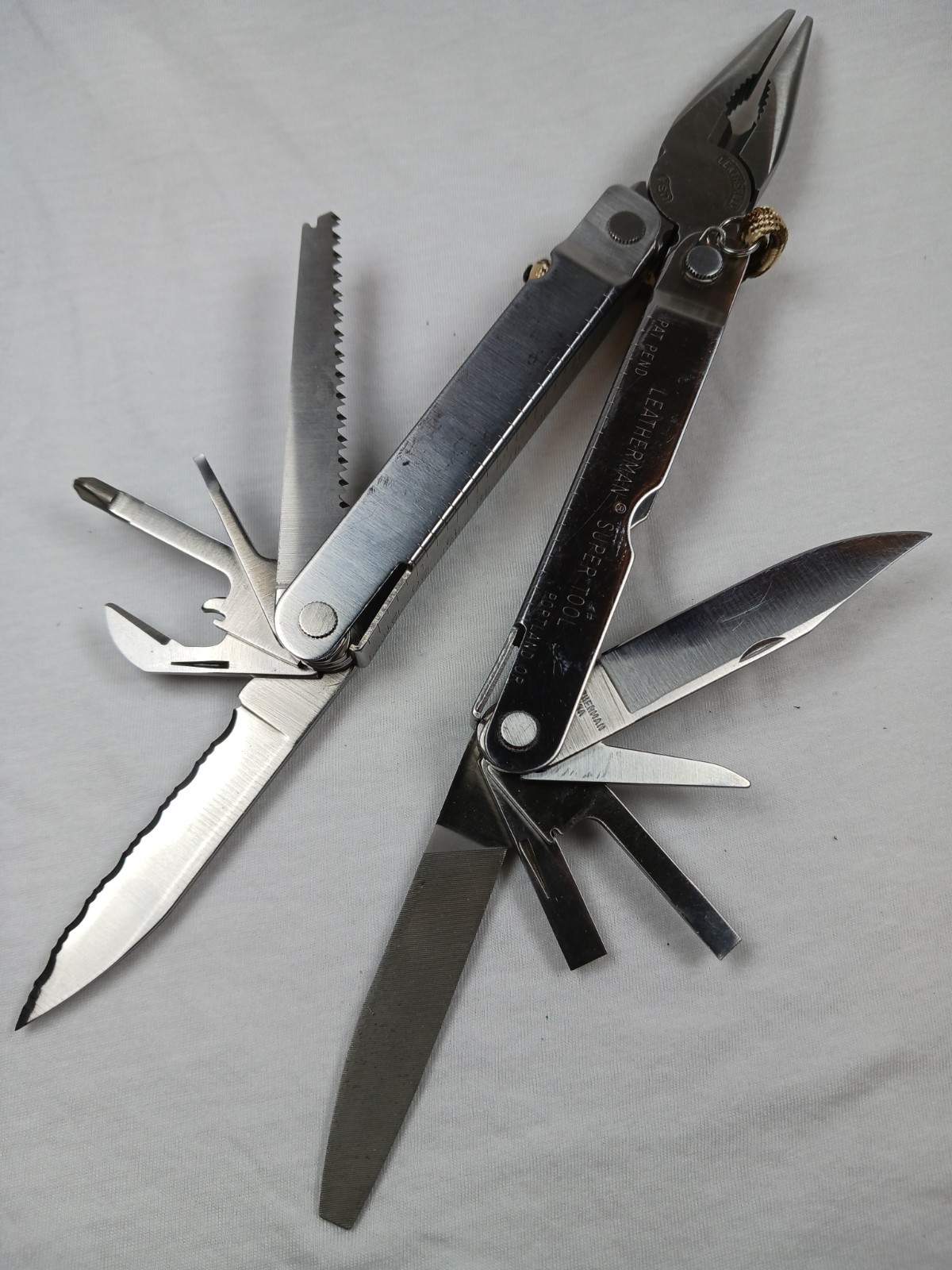 Leatherman Super Tool 100L 12-in-1 Stainless Multi-Tool Part Serrated w/ Sheath
