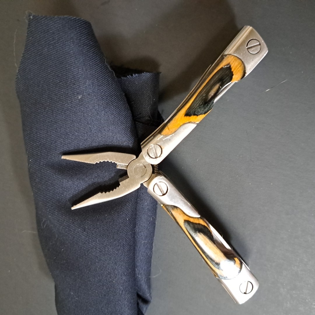 Multi tool With Laminated Wood Handles, Clean