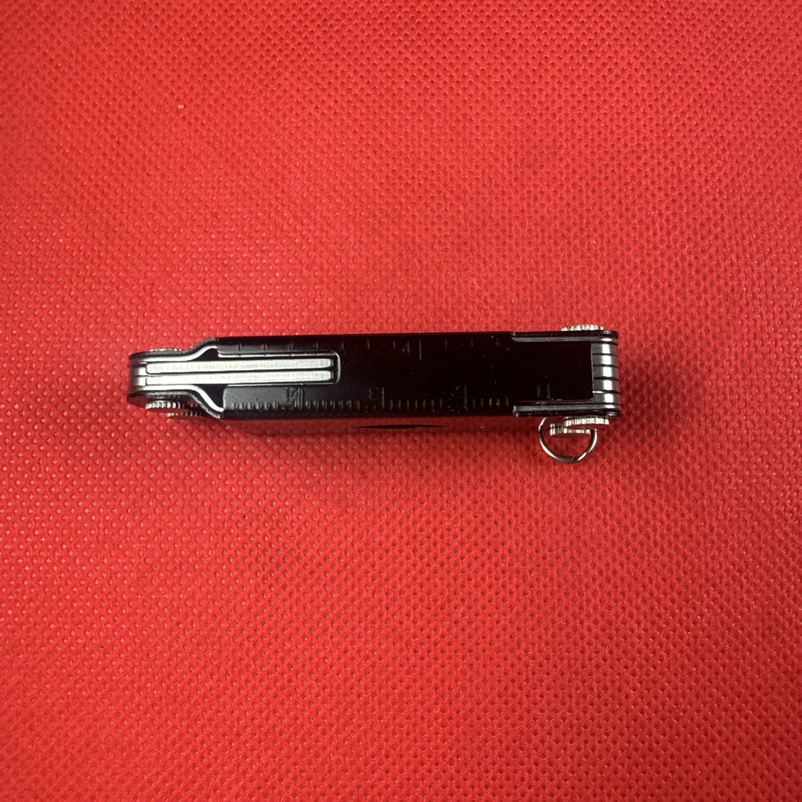 Nice Black Leatherman Micra Multi-Tool, scissor, knife, tweezer, screwdriver