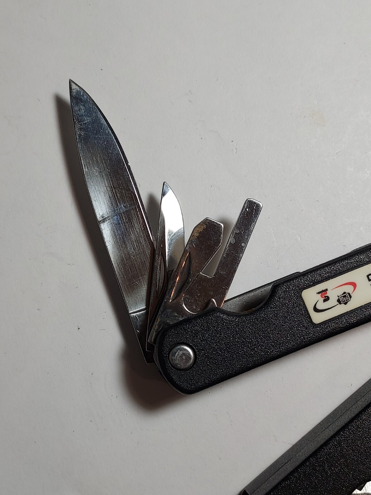 Barlow Multi Tool advertising Kleen Pig with sheath