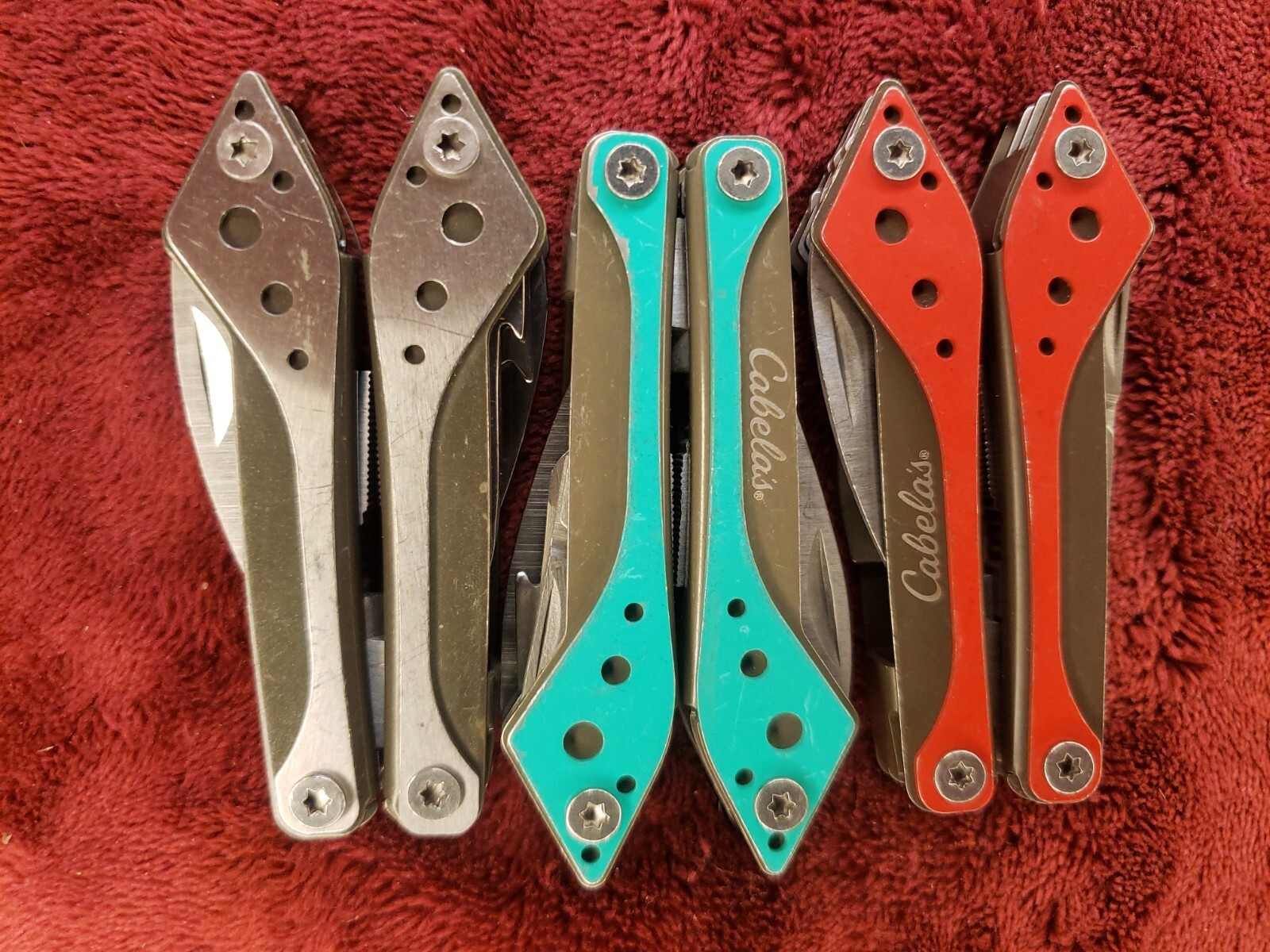 Lot of three Cabela’s Multi Tool Stainless Clear, Teal Green & Red