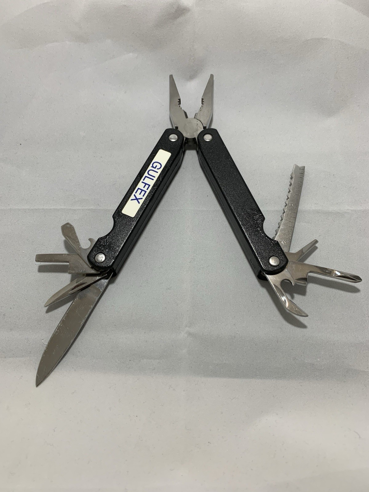 Barlow SuperPliers multi-tool featuring black handles with a “GULFEX” label