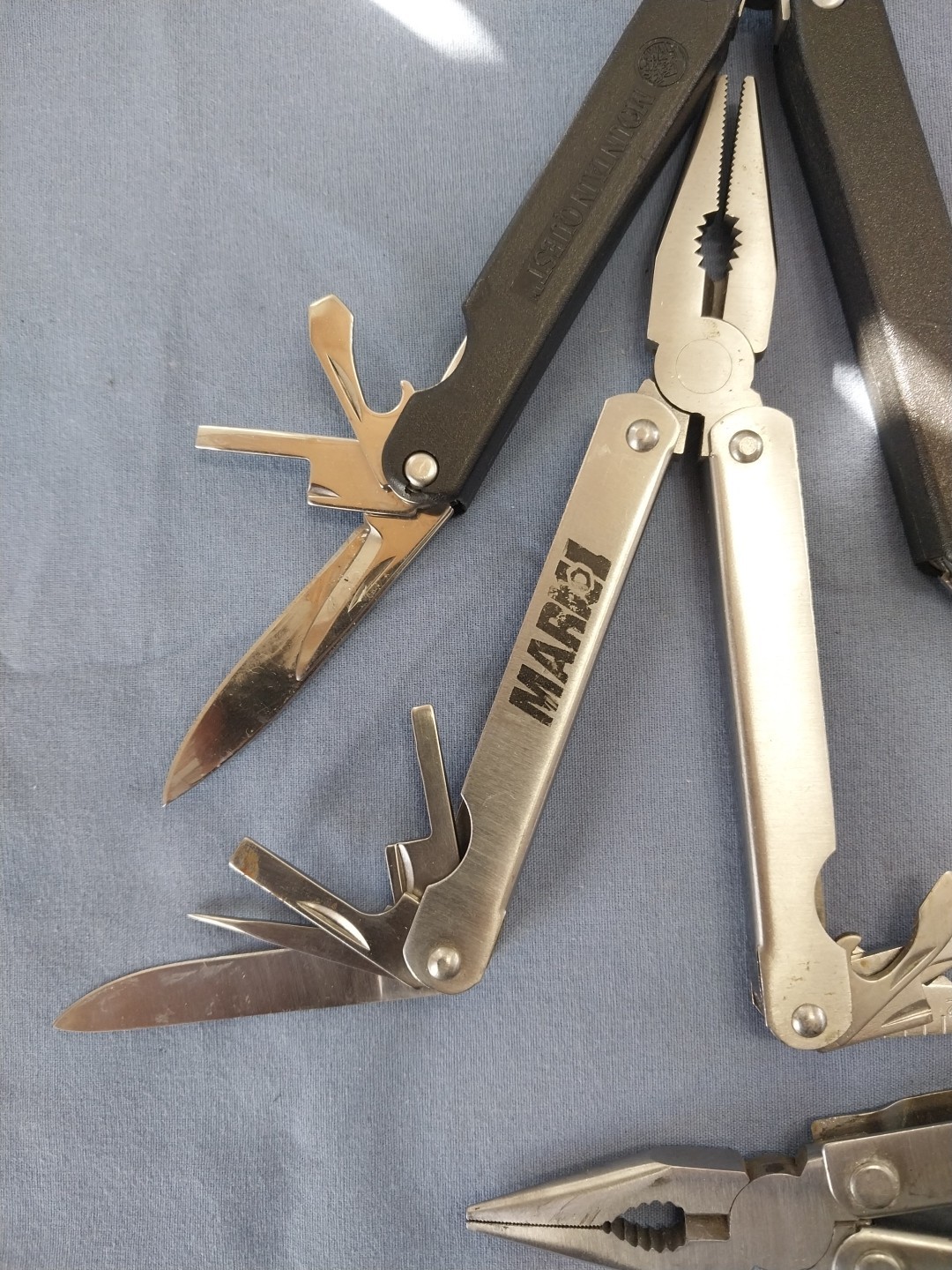 4 multi tools pliers screwdriver knife saw