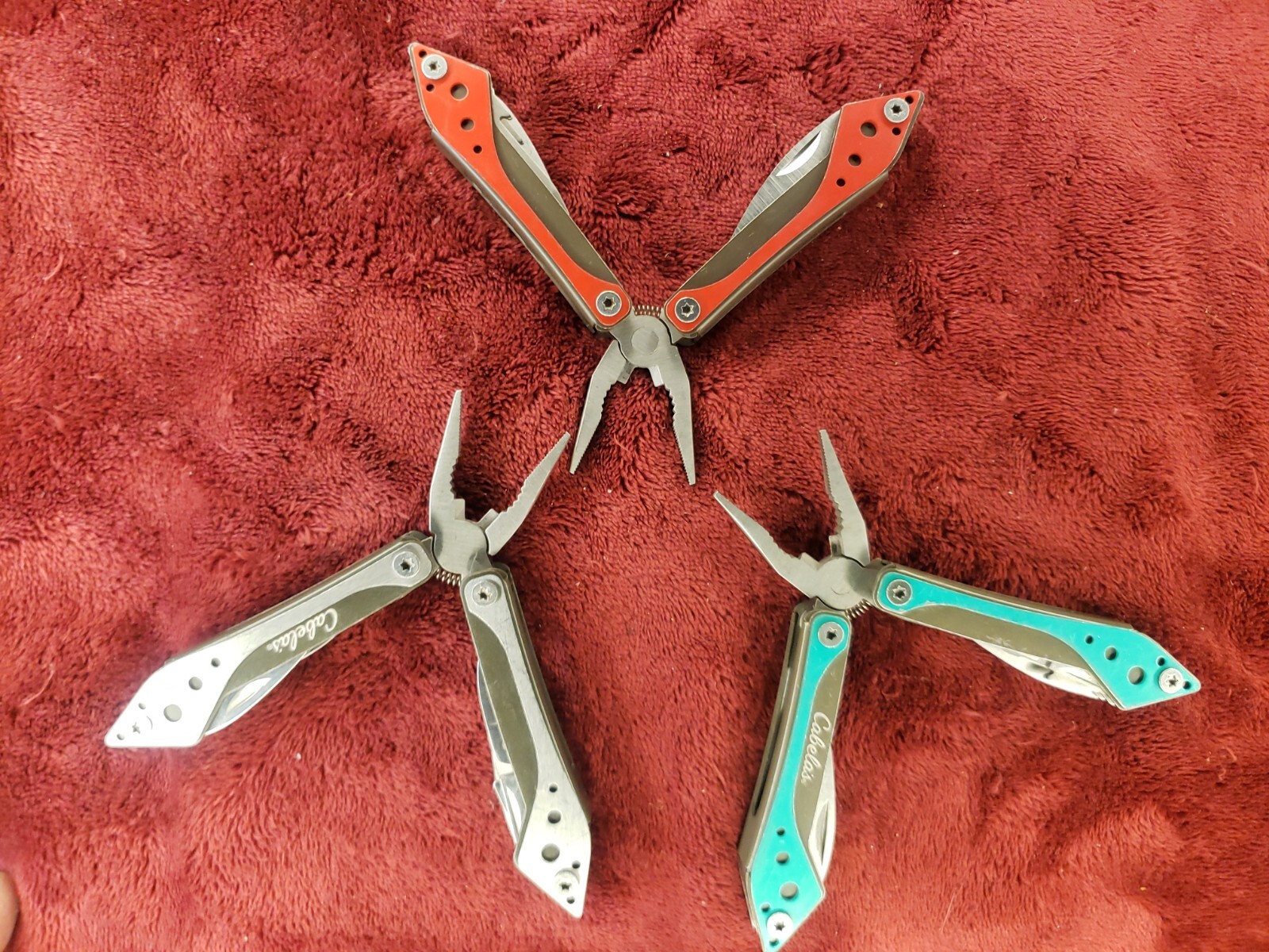 Lot of three Cabela’s Multi Tool Stainless Clear, Teal Green & Red