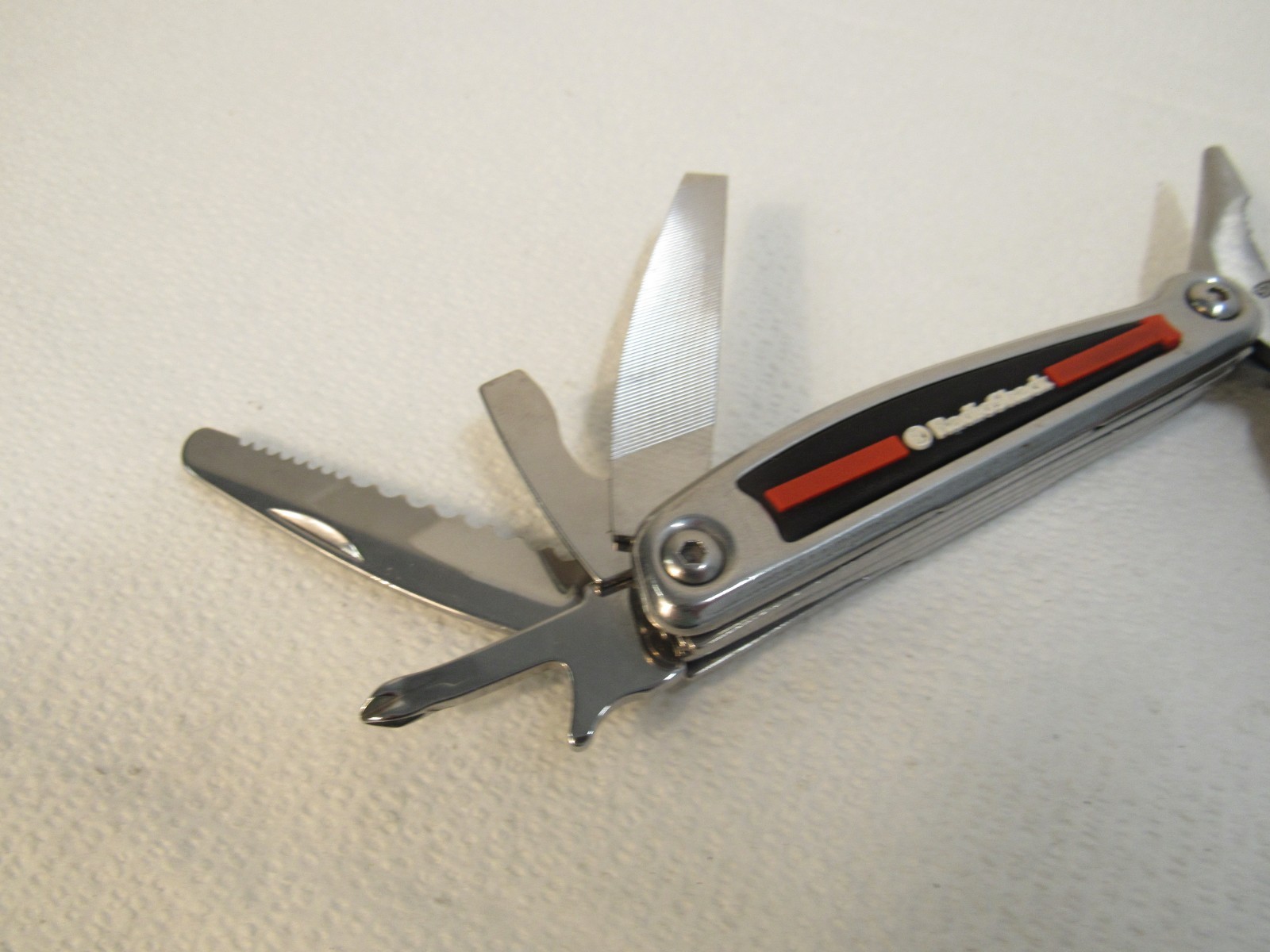 Radio Shack Multi-Tool Stainless Steel With Belt Case Red, Black, Stainless