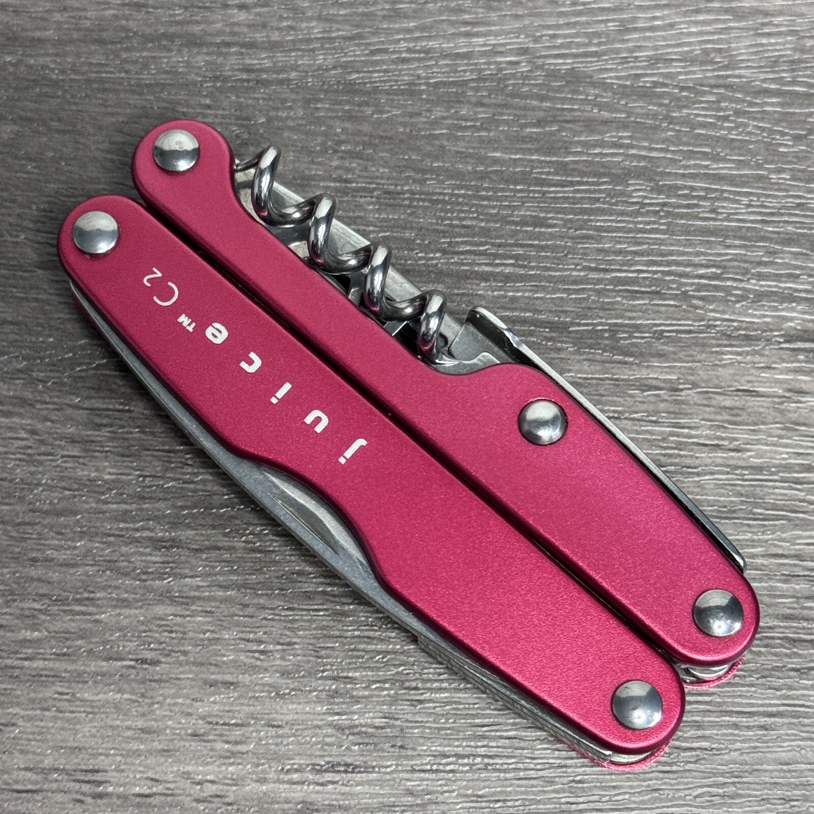 TWO Leatherman Juice C2 Red multitools. TM variants. Discontinued