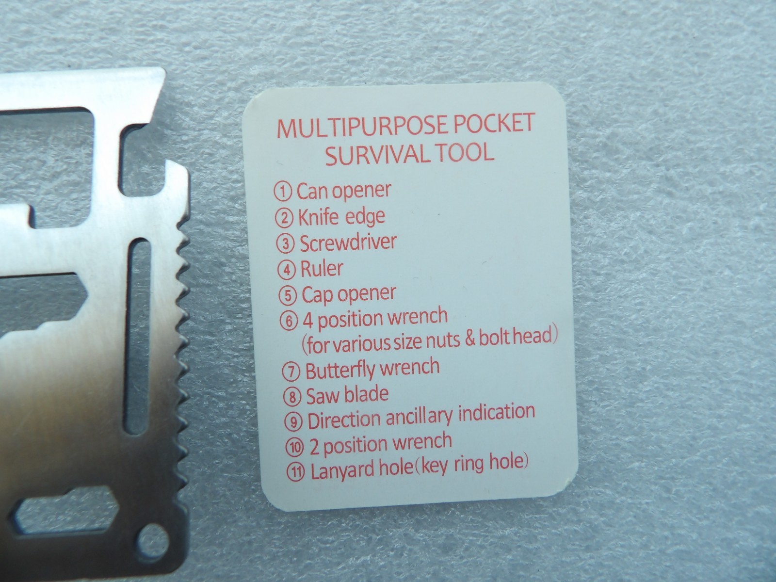 Wallet-sized stainless steel multi-tool with 11 different functional features