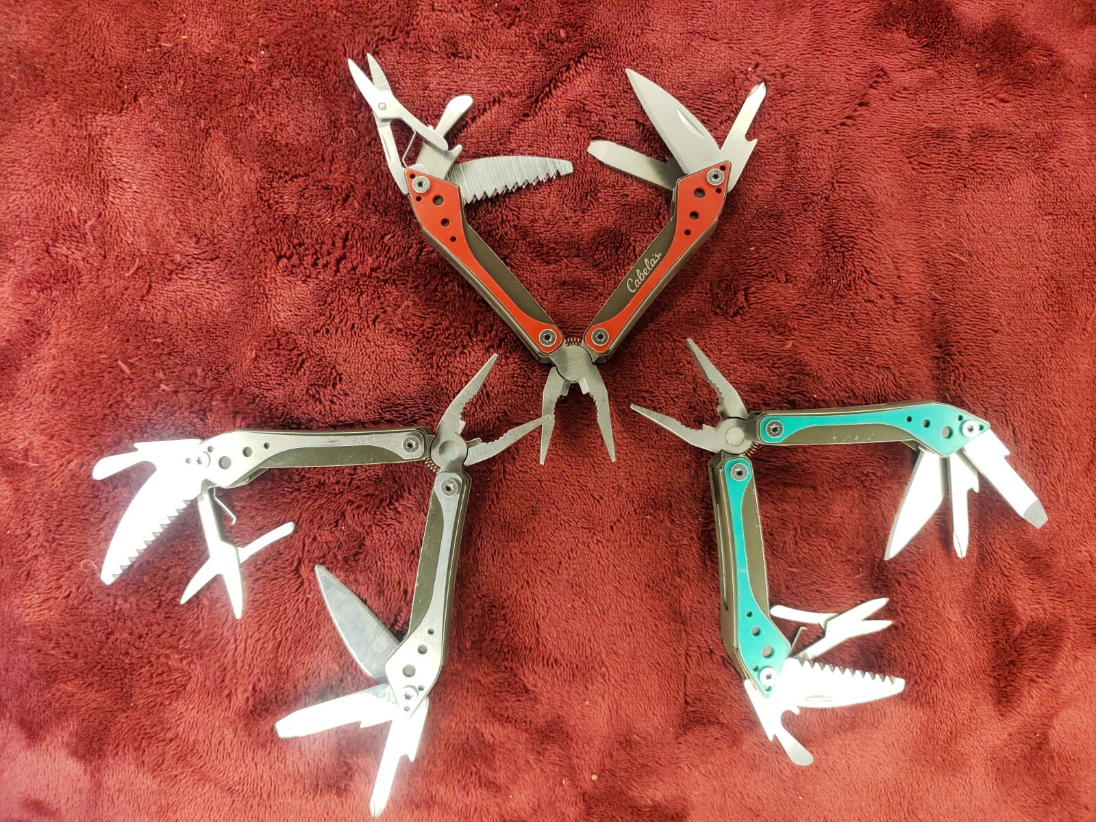 Lot of three Cabela’s Multi Tool Stainless Clear, Teal Green & Red