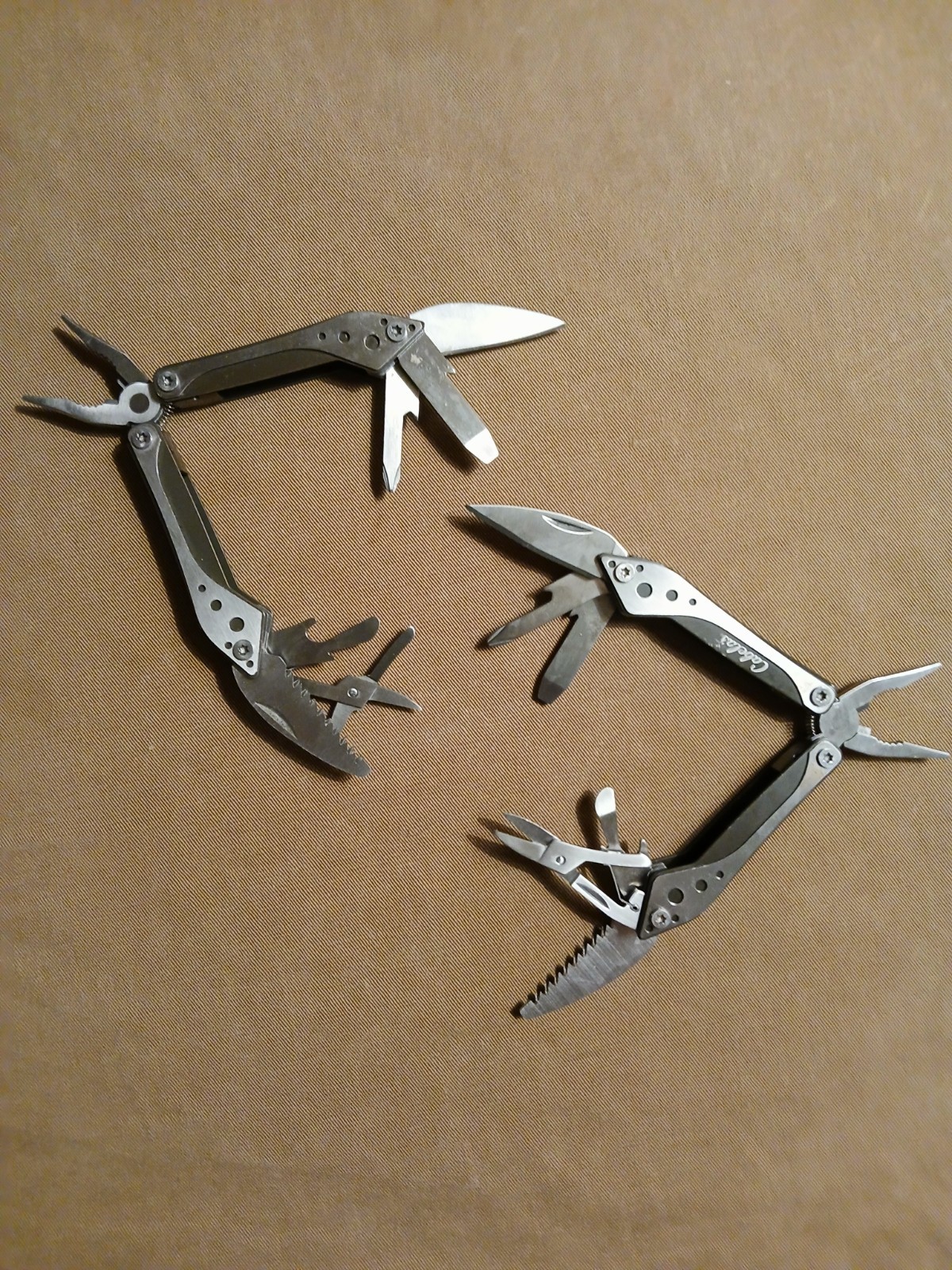 2) Cabela’s Multi-tool with nylon case unused