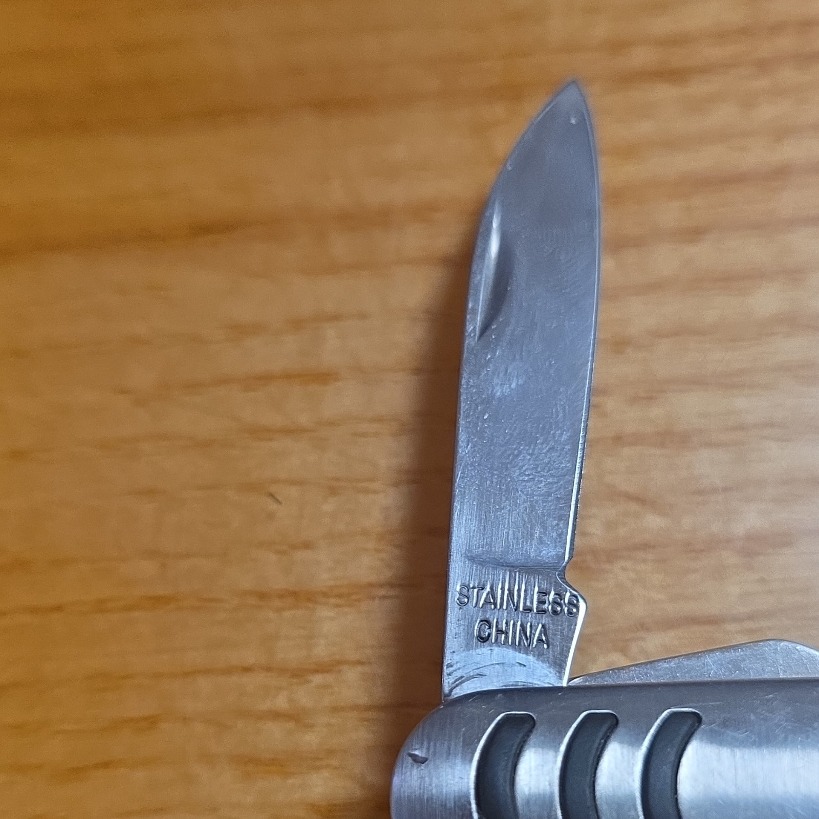 Silver Stainless Steel Multi-Tool, 5 Functions: Knife, Bottle Opener, Can Opener