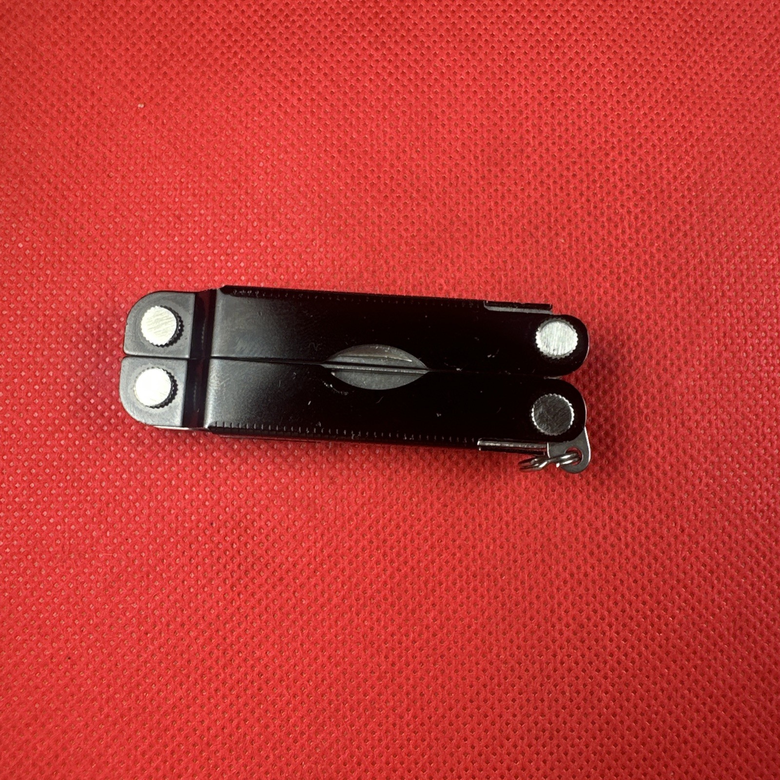Nice Black Leatherman Micra Multi-Tool, scissor, knife, tweezer, screwdriver