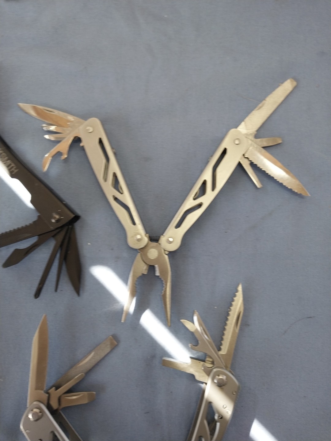 4 multi tools pliers screwdriver knife saw