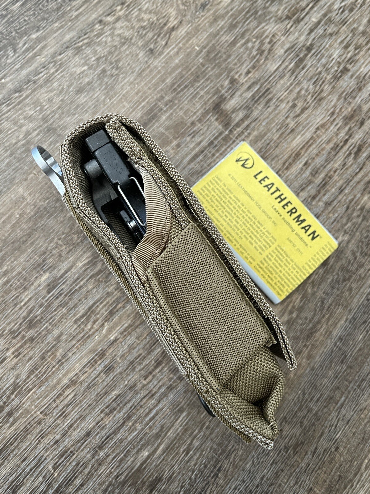 Leatherman MUT Black w/Titanium Clip multi tool, brown sheath. Made 12/2012