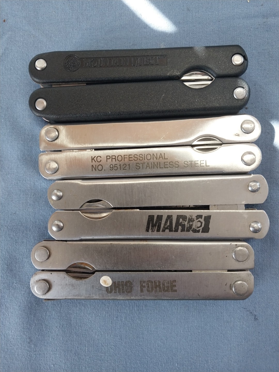 4 multi tools pliers screwdriver knife saw