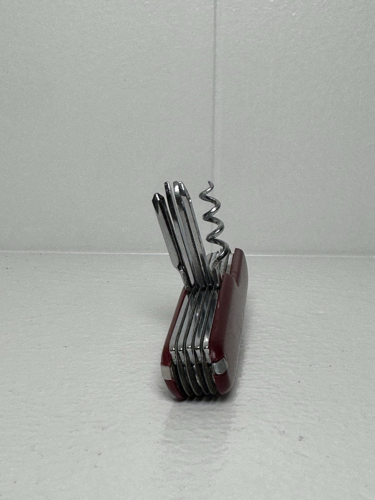 Red Swiss Army Knife With 12 Attachments Including Scissors, Saw, Etc