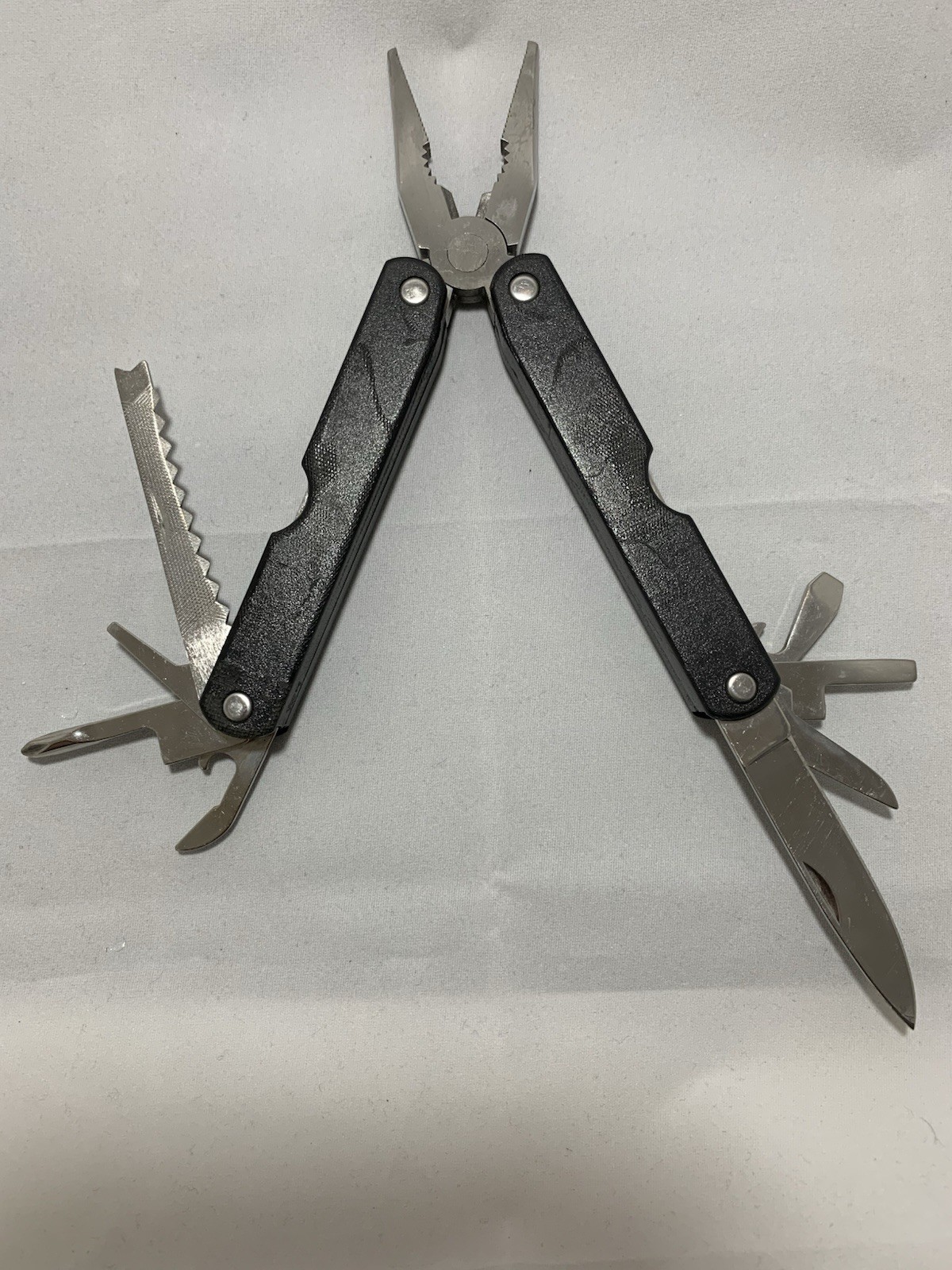 Barlow SuperPliers multi-tool featuring black handles with a “GULFEX” label
