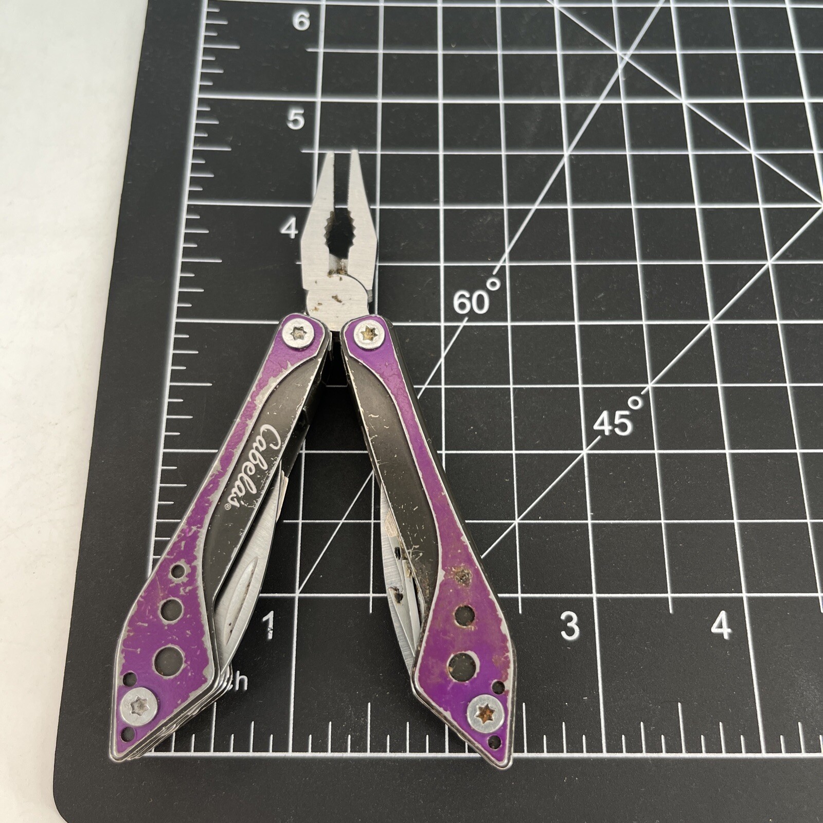LOT OF 2 Cabela’s PURPLE & SILVER Mini MultiTool Spring Open Pliers Scissors Saw