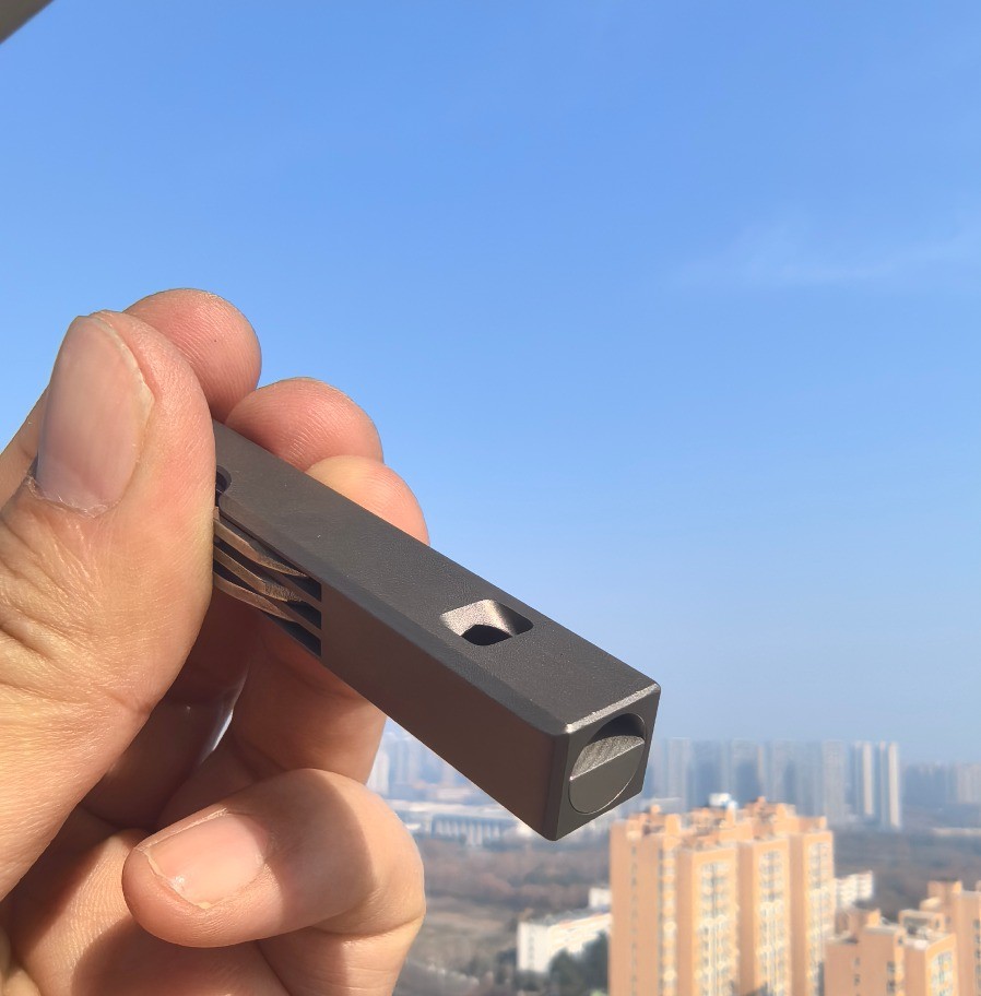 4-in-1 Compact Titanium Survival Tool Keychain with Saw Whistle and Pry Bar