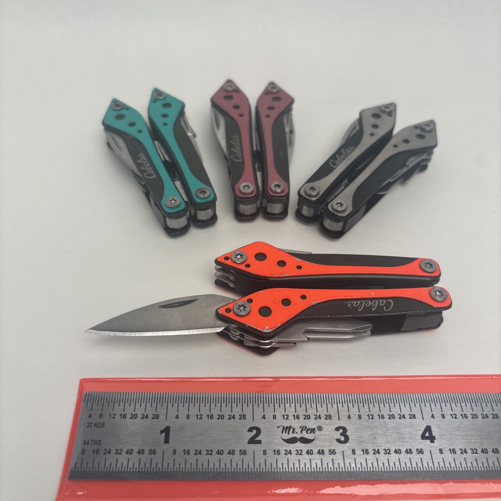 Cabela’s LOT of 4 Orange Teal Silver Pink Small Multi-Tool Camp Hike Hunt Fish
