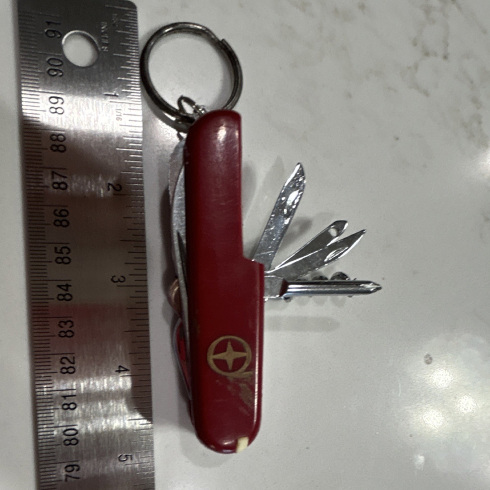 Red Multi-Tool with 7 Implements, Stainless Steel Blades, Key Ring Included