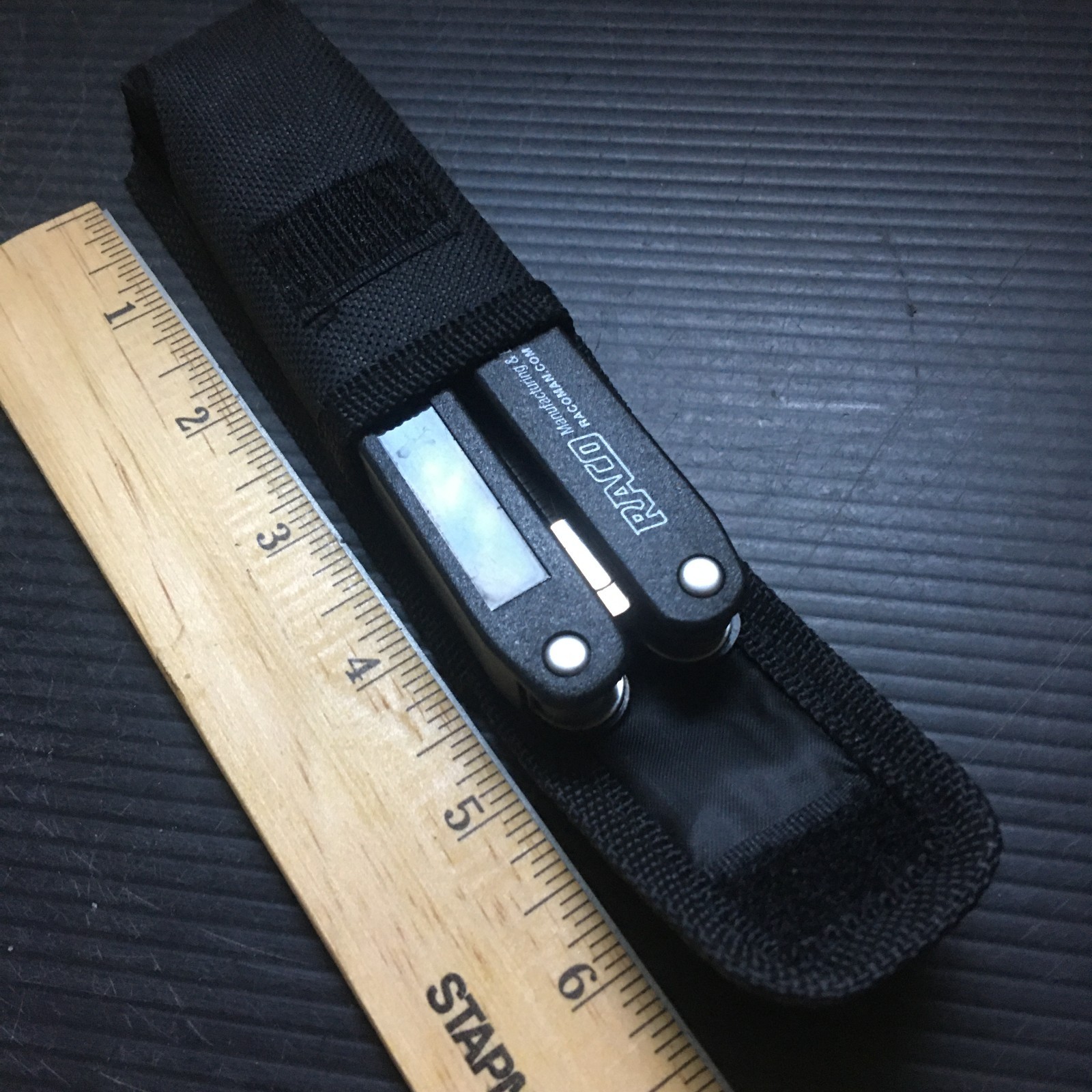 RACO 10-in-1 Multi-Tool with Pliers, Knife, Ruler & Saw in Black Nylon Sheath