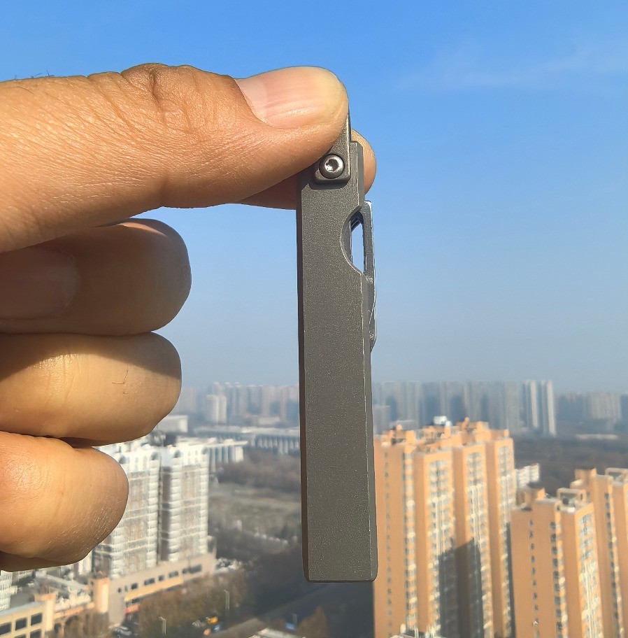 4-in-1 Compact Titanium Survival Tool Keychain with Saw Whistle and Pry Bar