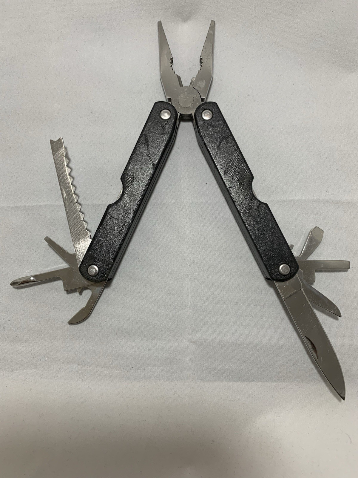 Barlow SuperPliers multi-tool featuring black handles with a “GULFEX” label