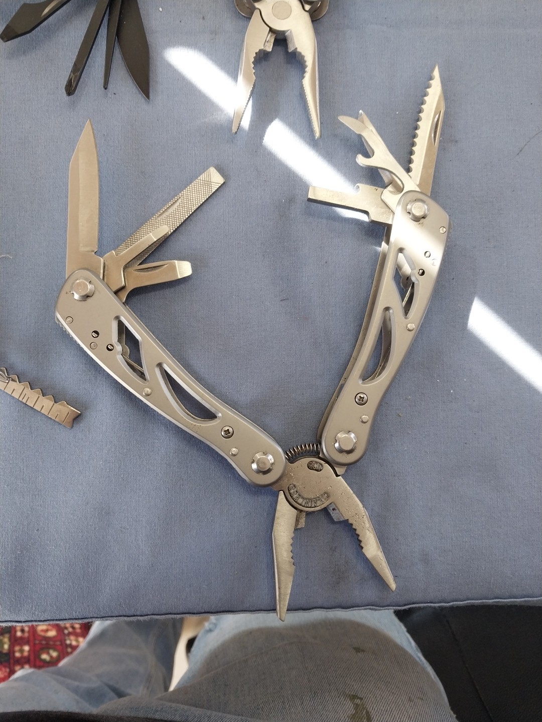 4 multi tools pliers screwdriver knife saw