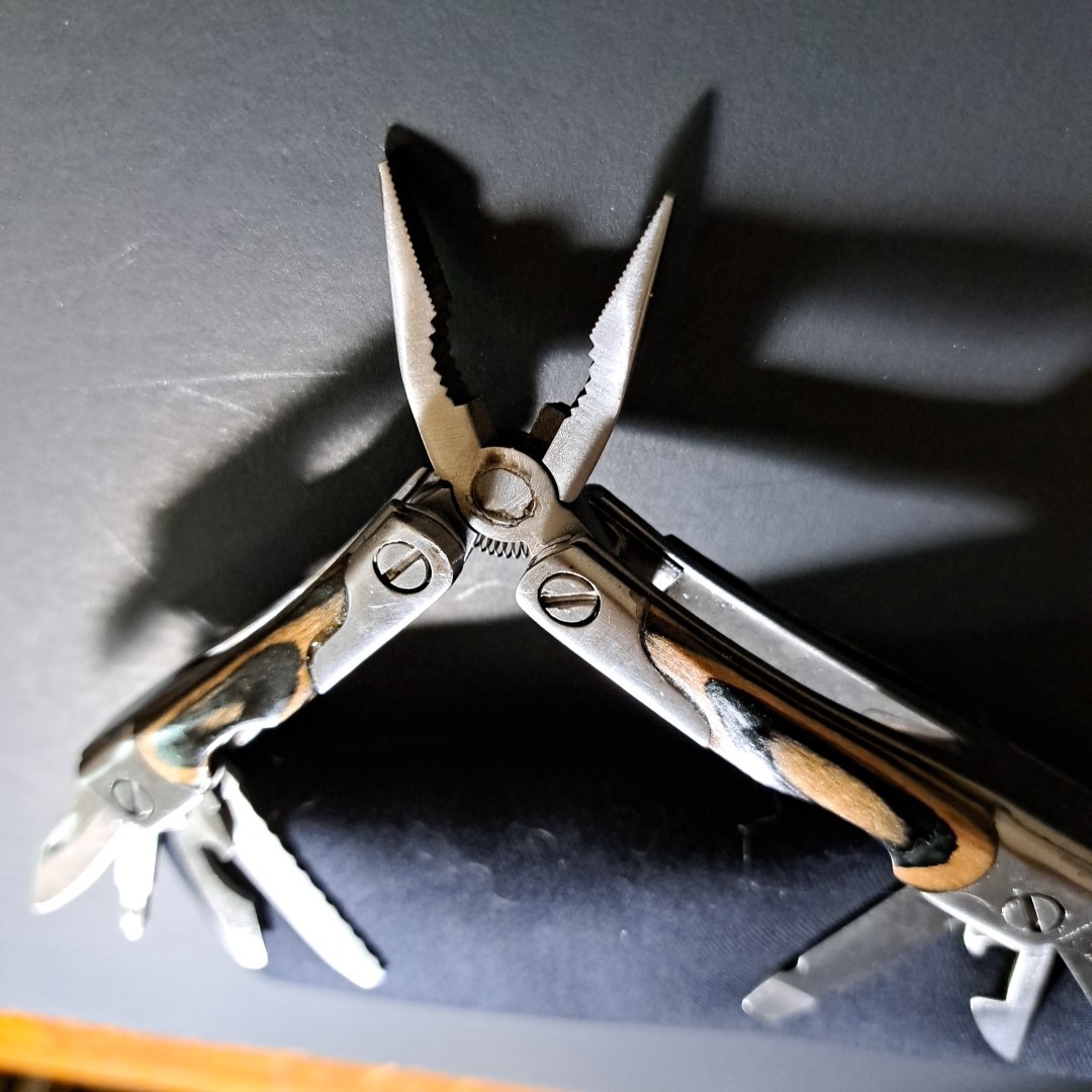 Multi tool With Laminated Wood Handles, Clean