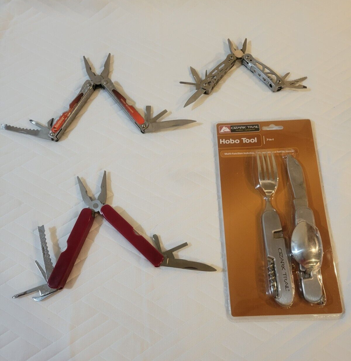 New Ozark Trail Hobo Tool (New) & three multi tools including one Sheffield