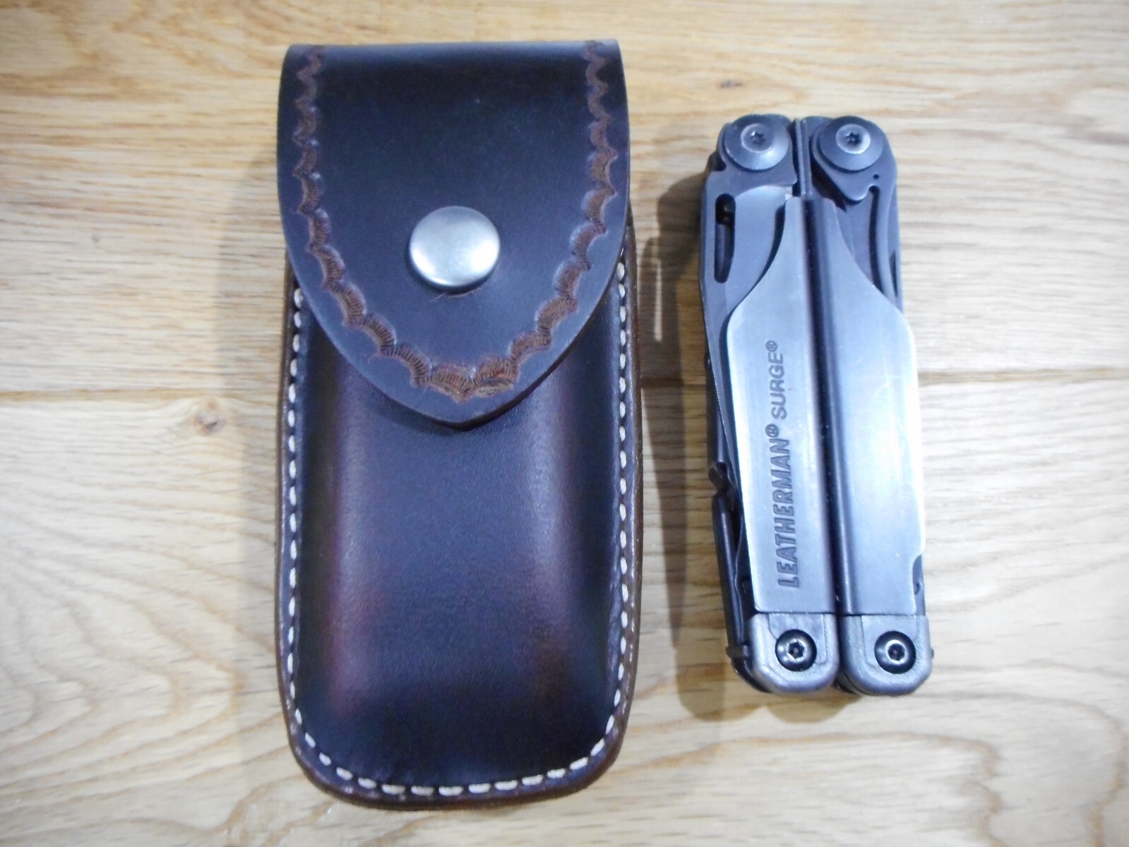 Leatherman Surge. Crazy Horse leather sheath. Tooled flap. Sheath only.