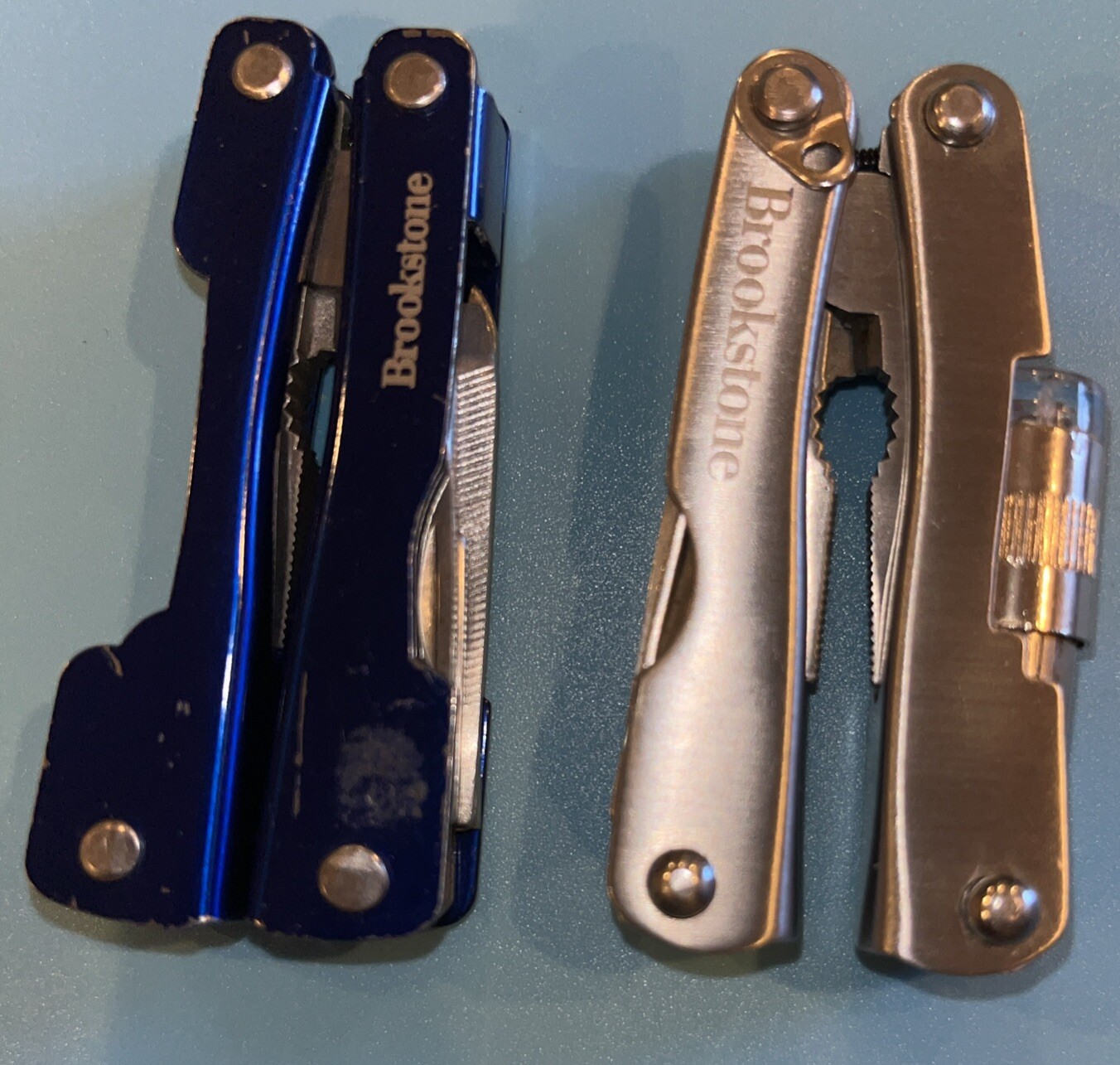 2 Brookstone Multi tool Knives, Flashlight Needs Battery