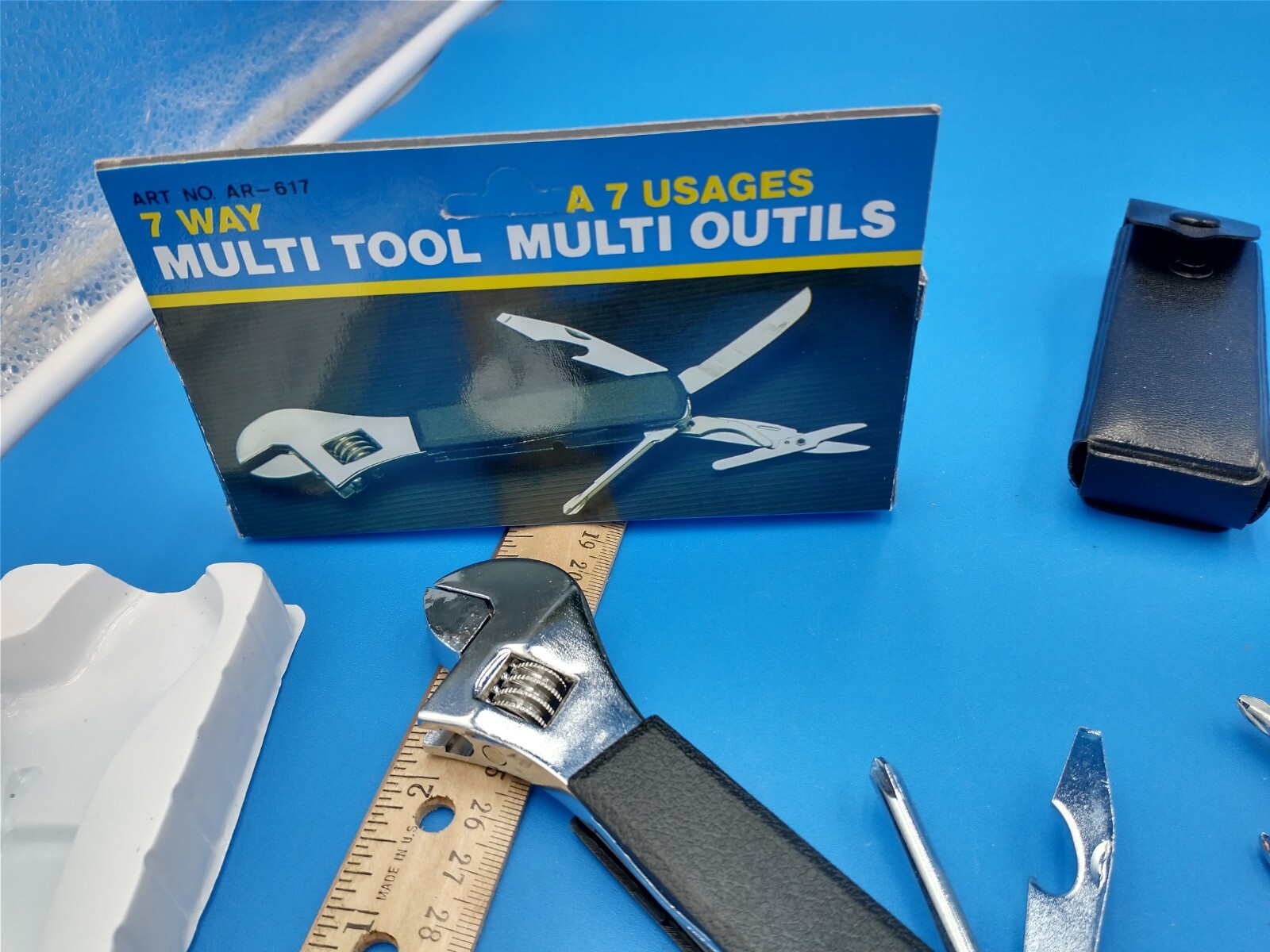 Lot of 2 unused multi-tools. One w/original box, other leather cover. #1031