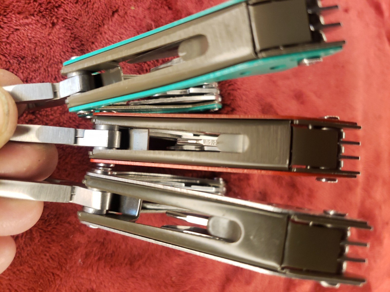 Lot of three Cabela’s Multi Tool Stainless Clear, Teal Green & Red