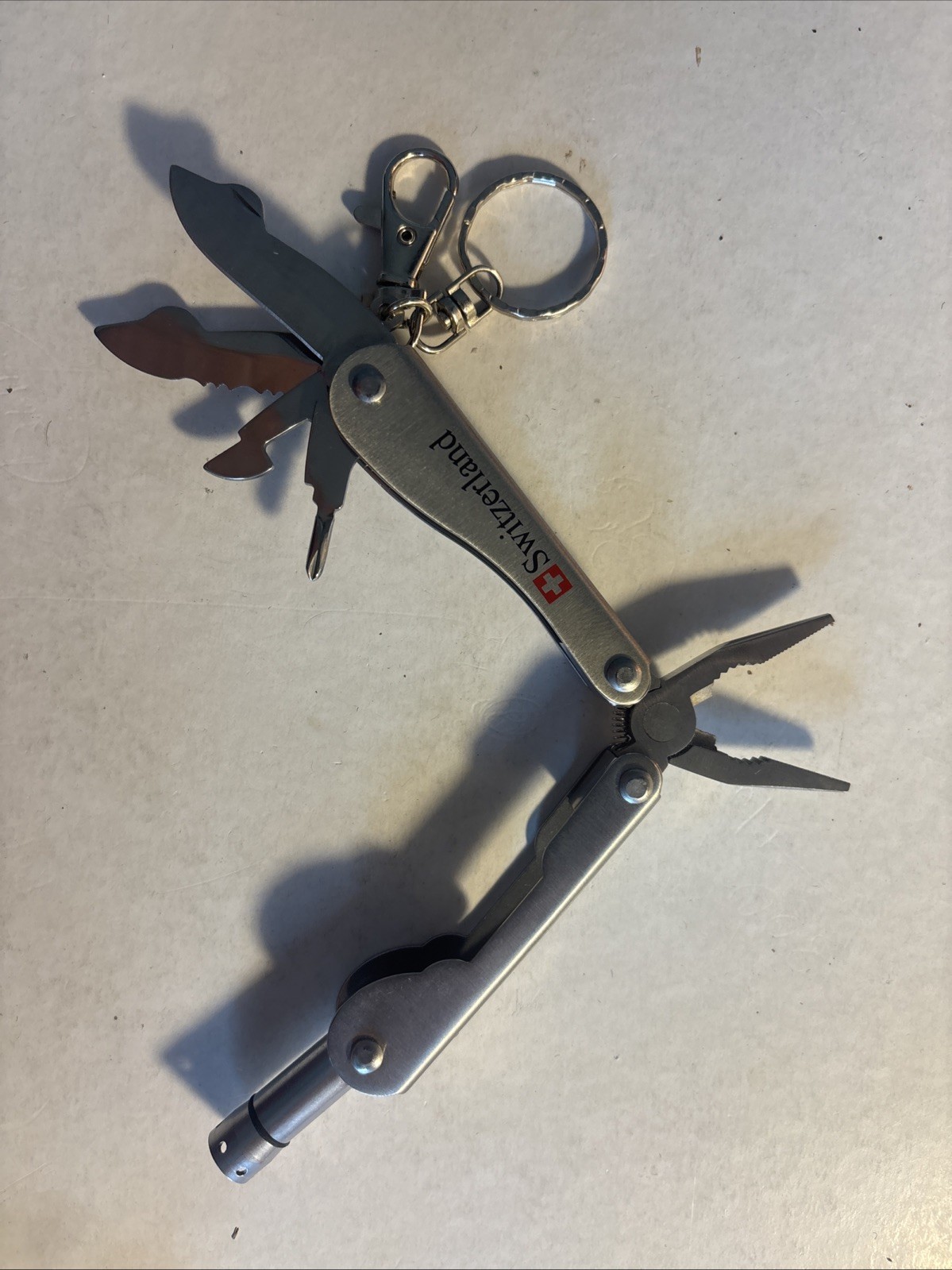 Multi tool folding Knives, pliers/light From Switzerland