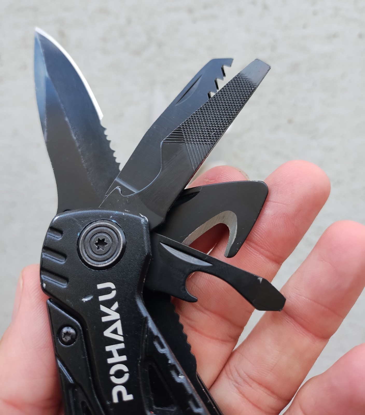 POHAKU BLACK & SILVER MULTI TOOL PLIERS KNIFE, SAW BLADE, FILE, ETC. LOT OF 2