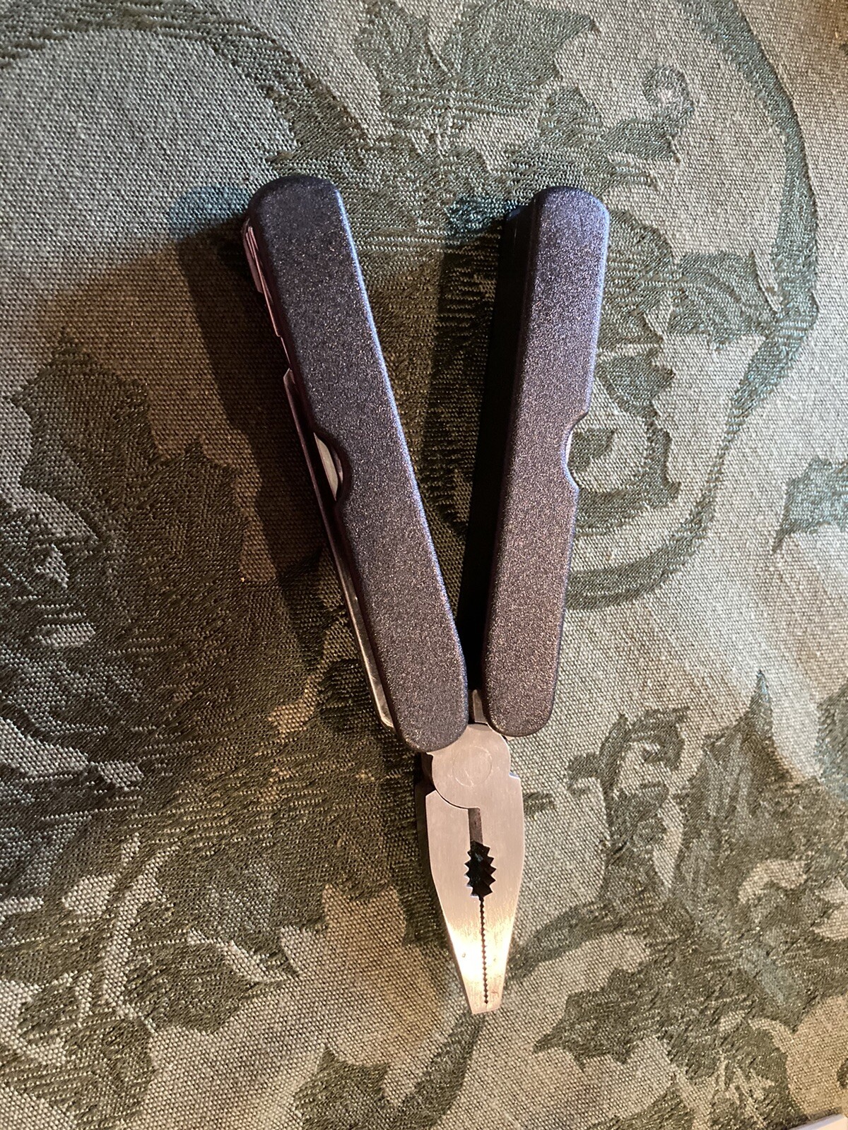Plier Multi Tool with knife, screwdrivers, can opener, bottle opener, etc.