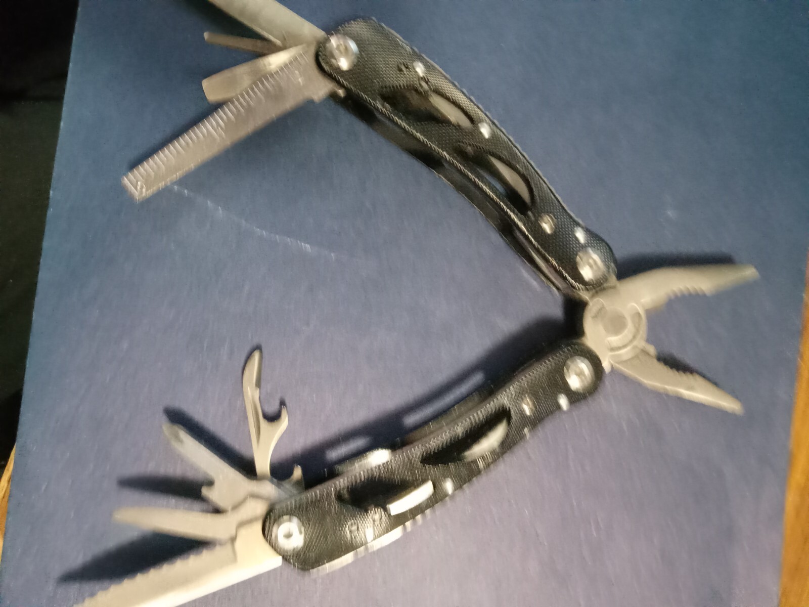 9 Multi-tool Black, no brand name with knife, plies, file, etc