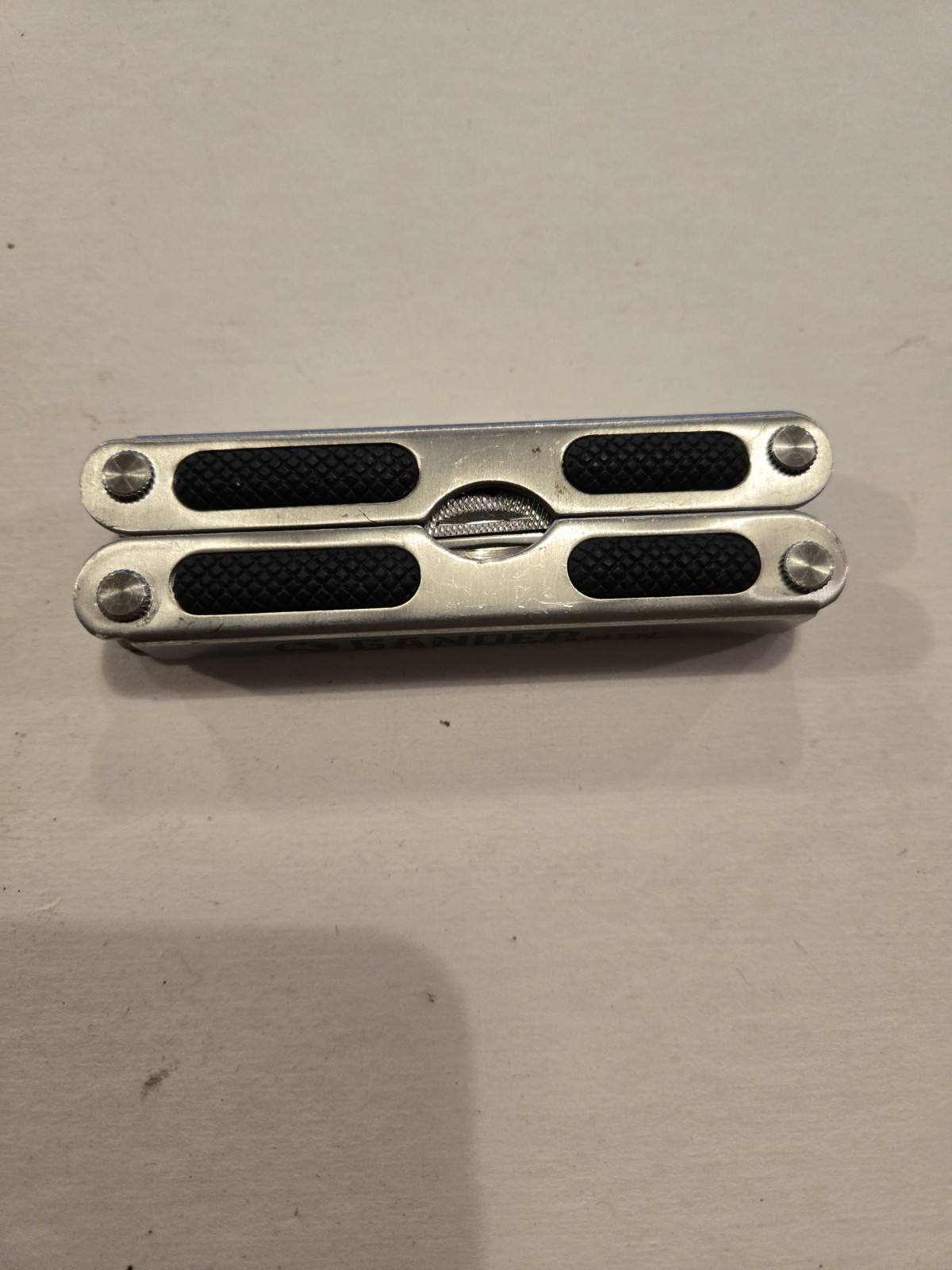 Gander Mountain 10-in-1 Multi Tool, Silver With Black Rubber Inlay Handles